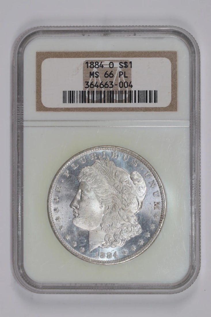 1884-O Morgan Dollar NGC MS66: 1884-O Morgan Dollar NGC MS66 Experience the majesty of the 1884-O Morgan Dollar, certified by the Numismatic Guaranty Corporation (NGC) as MS66. This stunning example of American numismatics boasts e