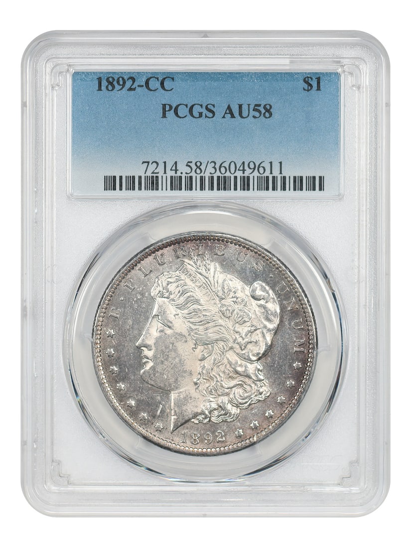 1892-CC $1 PCGS AU58 - Morgan Dollar Scarce CC-Mint: 1892-CC $1 PCGS AU58 - Morgan Dollar Scarce CC-Mint A rare and highly sought-after 1892-CC Morgan Dollar, graded AU58 by PCGS, is up for auction. This scarce coin from the Carson City Mint boasts a st