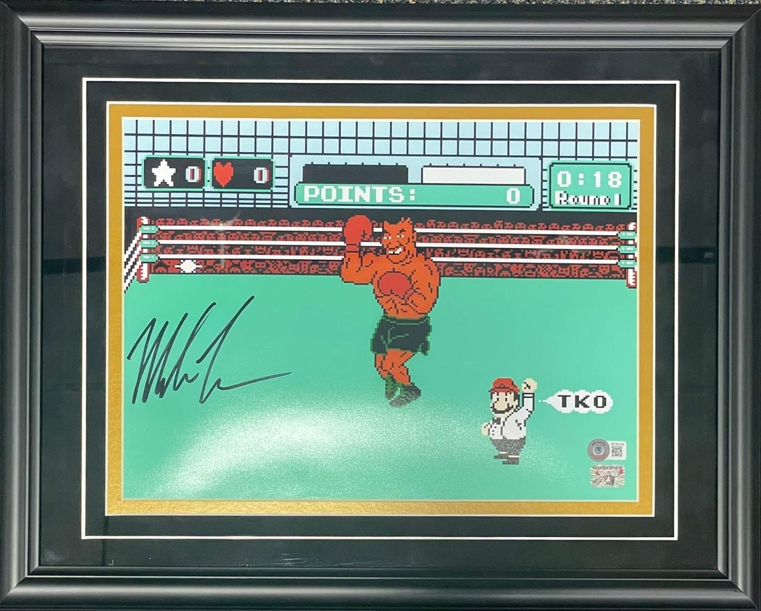 (BVG) Mike Tyson Autographed Framed 11x14 Photo: (BVG) Mike Tyson Autographed Framed 11x14 Photo Own a piece of boxing history with this autographed 11x14 photo of Mike Tyson, signed in black sharpie by the legendary boxer himself. Authenticated by