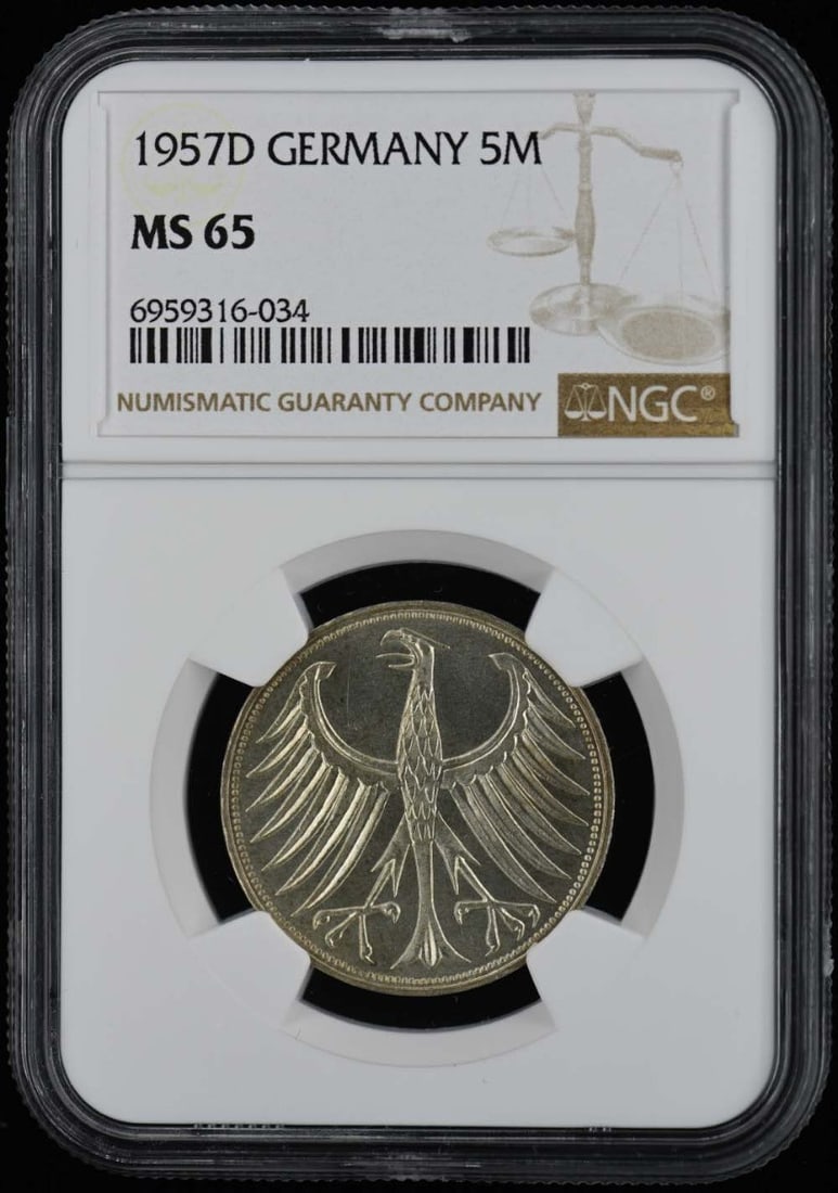MS65 1957D GERMANY 5M NGC: MS65 1957D GERMANY 5M NGC Experience the beauty of 1957 German currency with this stunning MS65 circulated coin, certified by NGC and graded for its exceptional condition. The 5M mark on the obverse i