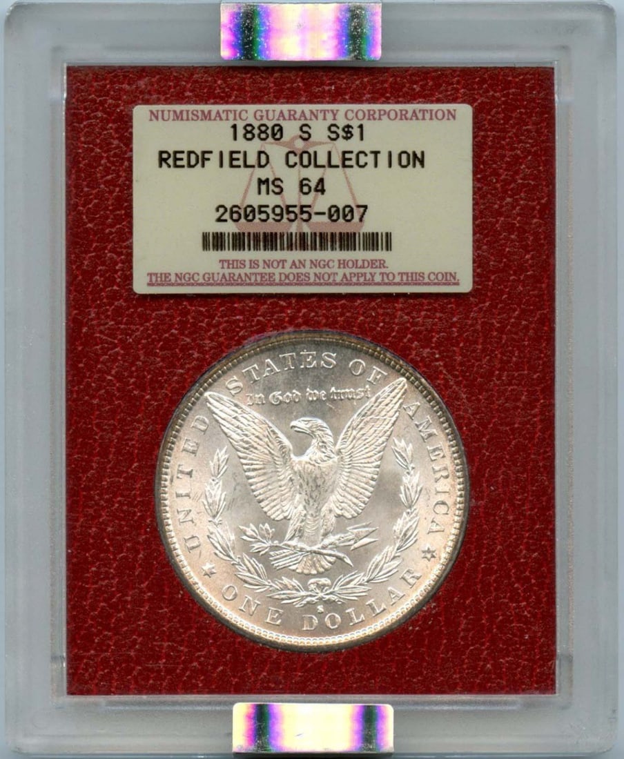 1880-S Silver Morgan Dollar - Redfield Hoard, NGC MS64: 1880-S Silver Morgan Dollar - Redfield Hoard, NGC MS64 Experience the majesty of the 1880-S Silver Morgan Dollar, certified MS64 by NGC and part of the renowned Redfield Hoard. This stunning coin boas