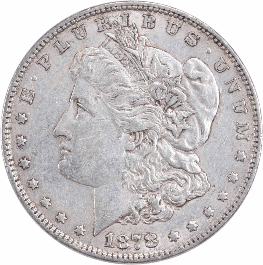 1878 Morgan Silver Dollar - 7TF Reverse, 1879 AU Uncertified: 1878 Morgan Silver Dollar - 7TF Reverse, 1879 AU Uncertified A rare and highly sought-after 1878 Morgan Silver Dollar, graded AU Uncertified, boasts its original 7TF reverse, a hallmark of the series'
