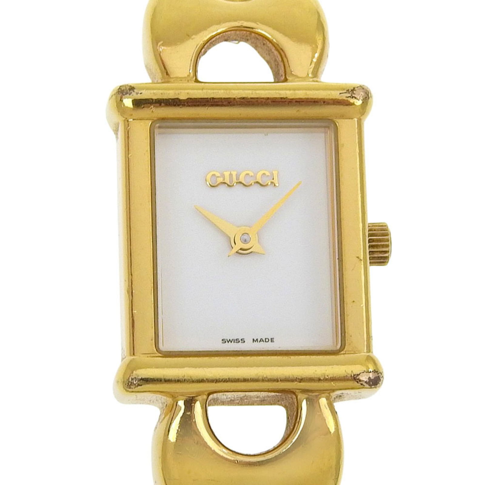 Wristwatch Gucci: Wristwatch Gucci A stunning gold plated Gucci wristwatch, perfect for adding a touch of luxury to any outfit. With its sleek 18mm case and white dial, this elegant timepiece is sure to make a statemen