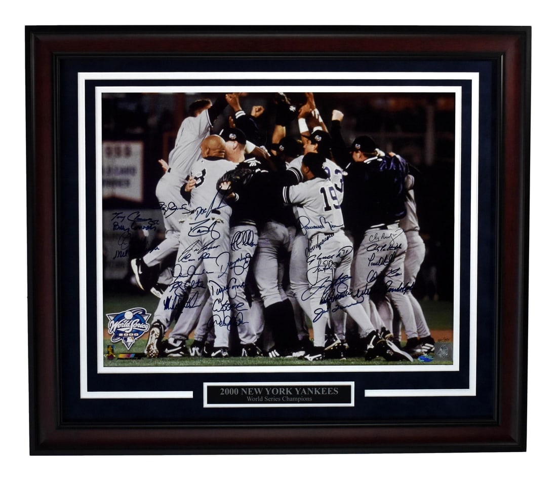 PSA 2000 Yankees World Series Celebration Team Signed (27) 16x20 Photo Framed: PSA 2000 Yankees World Series Celebration Team Signed (27) 16x20 Photo Framed Experience the magic of the 2000 World Series celebration with this incredible team-signed photo, authenticated by Profess