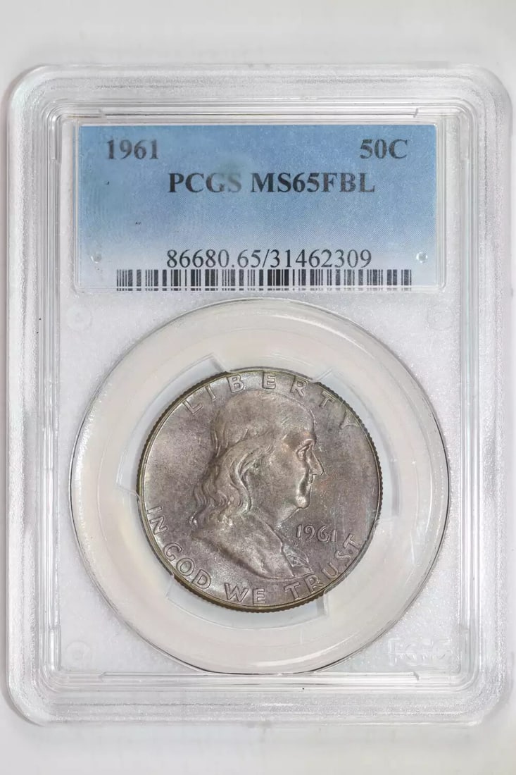 1961 Franklin Half Dollar PCGS MS65 FBL: 1961 Franklin Half Dollar PCGS MS65 FBL Experience the beauty of American history with this stunning 1961 Franklin Half Dollar, certified by PCGS as MS65 FBL. Struck from silver and bearing the iconic