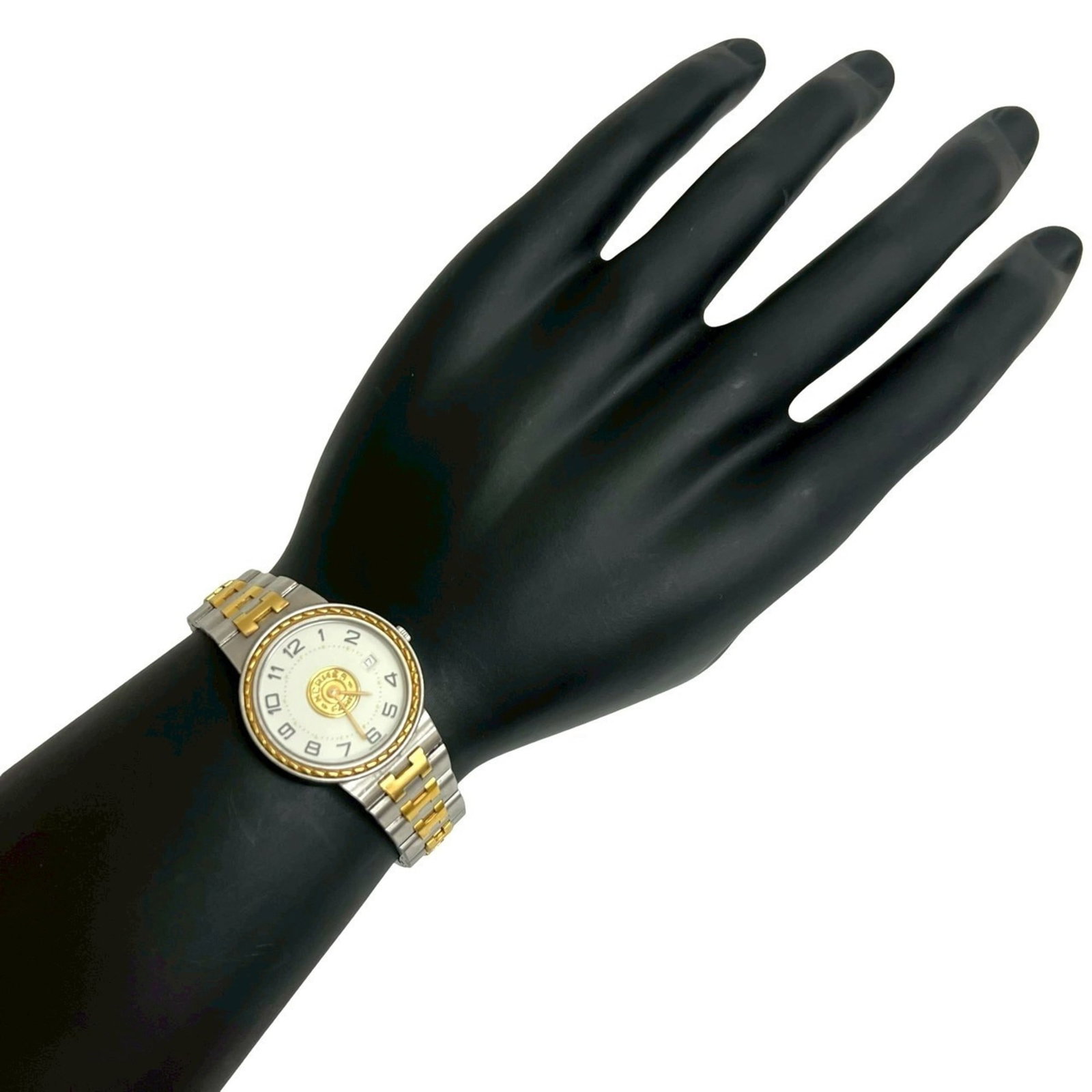 Wristwatch Hermes: Wristwatch Hermes A pre-owned Hermes wristwatch, boasting a sleek 27mm gold plated case and stainless steel band, adds a touch of luxury to any outfit. With its durable construction and timeless desig