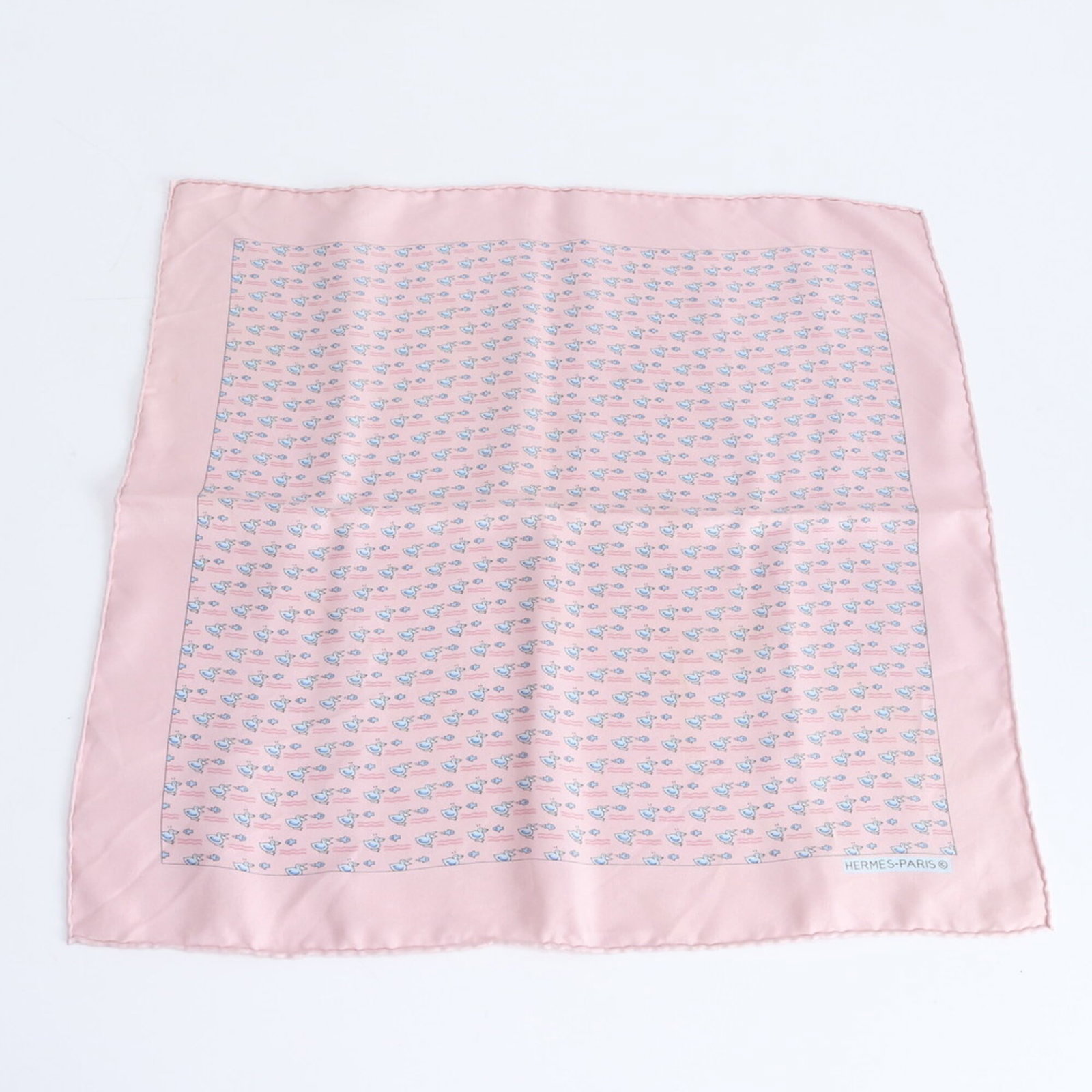 Hermes Silk Scarf: Hermes Silk Scarf A beautiful, pre-owned Hermes silk scarf in a stunning pink hue adds a touch of elegance to any outfit. Made from luxurious silk and measuring 42cm x 43cm, this classic accessory is