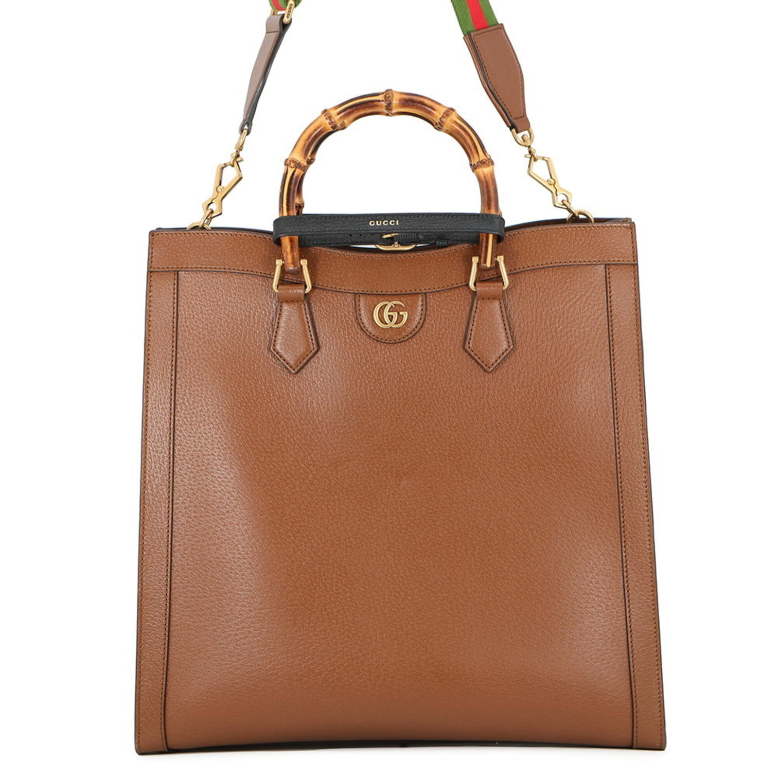 Gucci leather tote bag: Gucci leather tote bag This stunning Gucci leather tote bag is a timeless classic, boasting rich brown leather and elegant gold hardware that adds a touch of sophistication to any outfit. With its