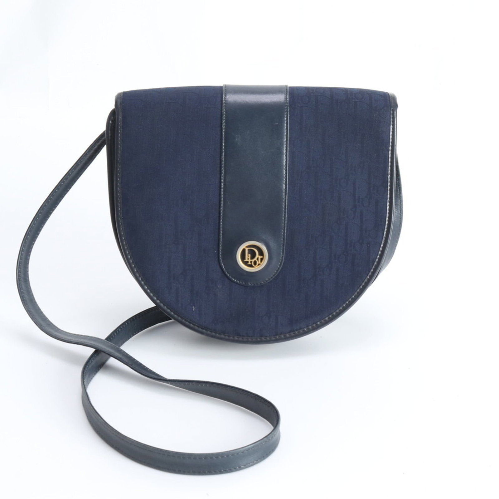 Christian Dior Leather Canvas Shoulder Bag: Christian Dior Leather Canvas Shoulder Bag A timeless piece from the iconic Christian Dior brand, this navy leather canvas shoulder bag boasts classic sophistication with its clean lines and structure