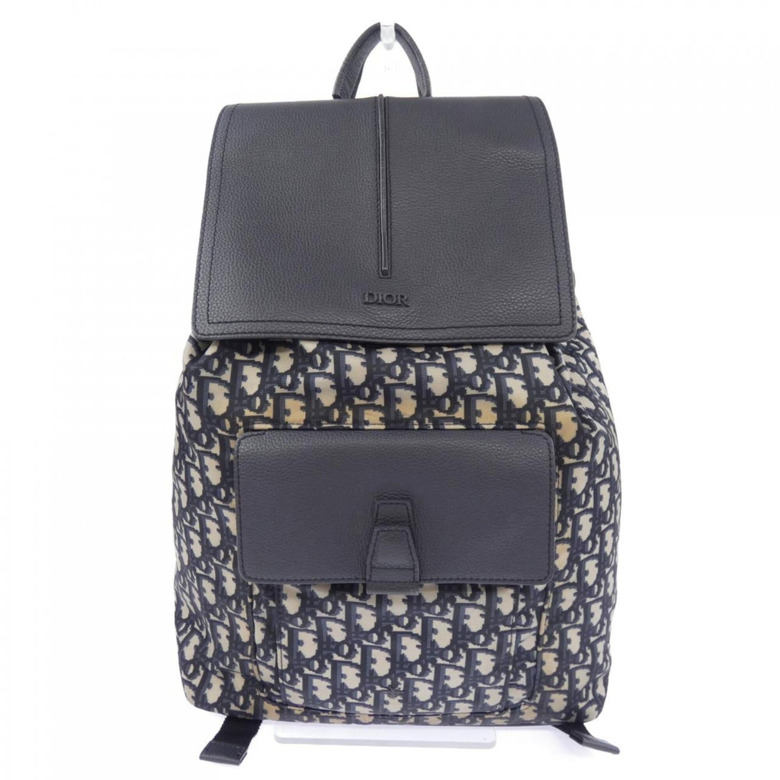 Christian Dior Backpack: Christian Dior Backpack Elevate your daily style with the iconic Christian Dior backpack, boasting a timeless beige and navy color combination that exudes sophistication. This pre-owned piece still re