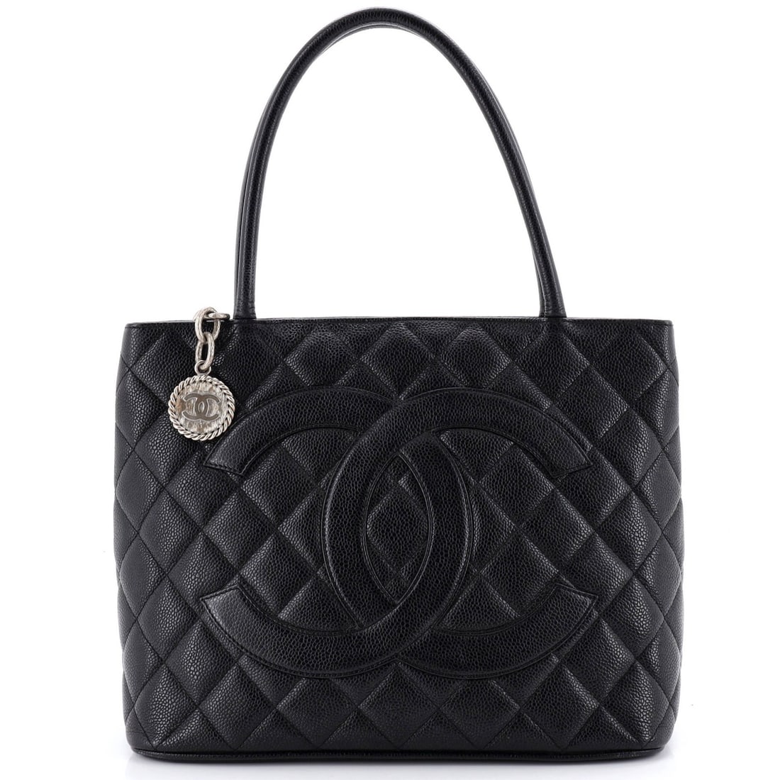 Caviar quilted tote by Chanel: Caviar quilted tote by Chanel Own the epitome of luxury with this exquisite Chanel Caviar quilted tote, boasting sleek black leather exterior and interior, adorned with intricate gun metal hardware. T
