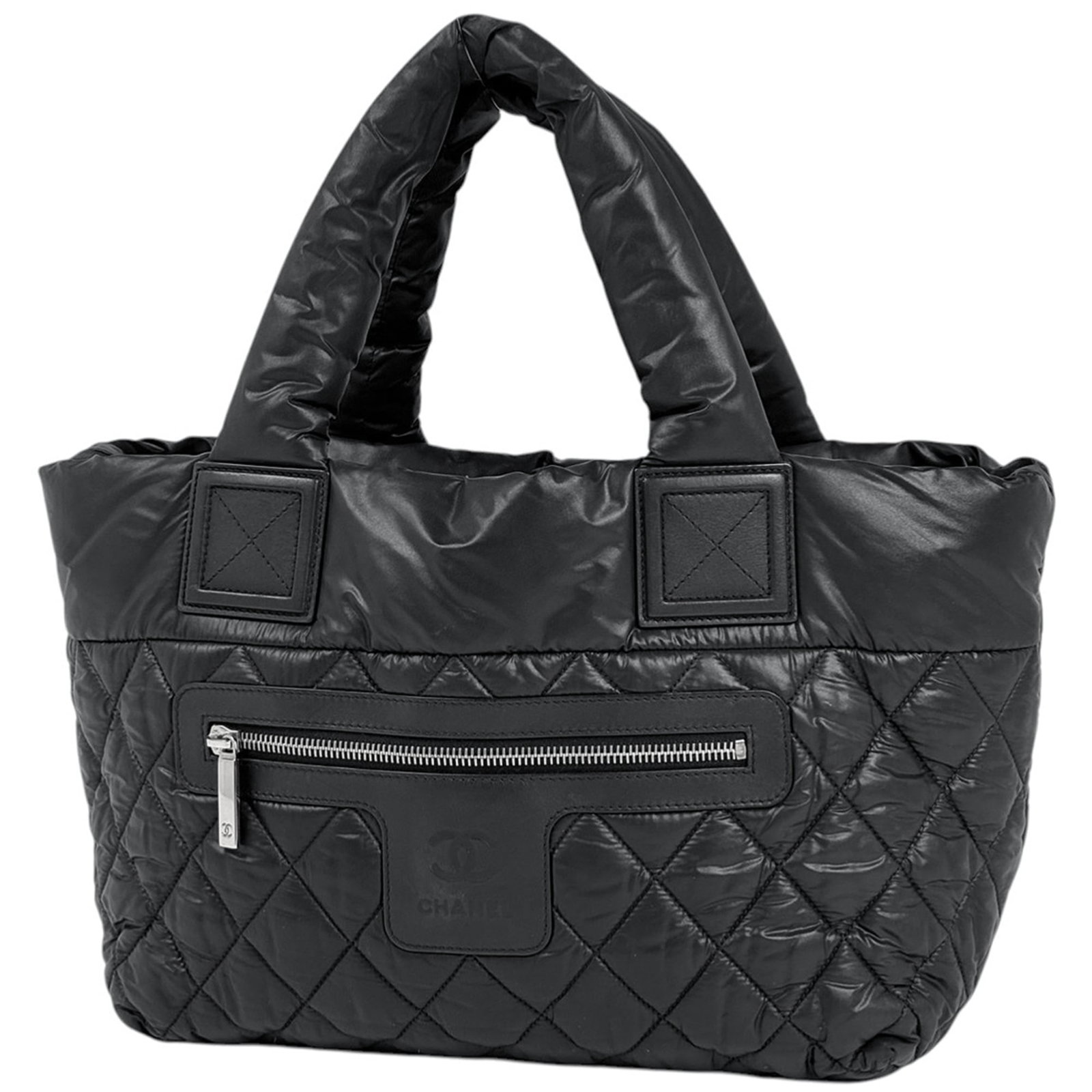 Chanel Handbag, Tote Bag Nylon, Leather: Chanel Handbag, Tote Bag Nylon, Leather A sleek and sophisticated Chanel tote bag, crafted from high-quality nylon and leather, boasts a timeless black design that exudes effortless chic. With its cla