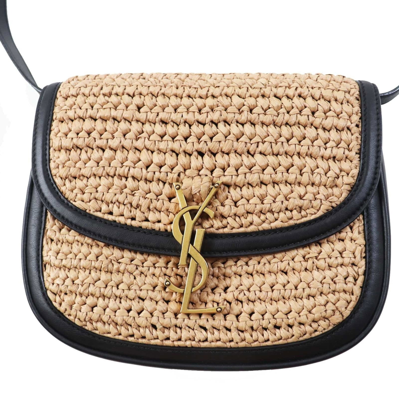 Saint Laurent Raffia Leather Bag: Saint Laurent Raffia Leather Bag Elevate your style with the iconic Saint Laurent Raffia Leather Bag, boasting a sleek black design and gold hardware accents that add a touch of luxury. Crafted from