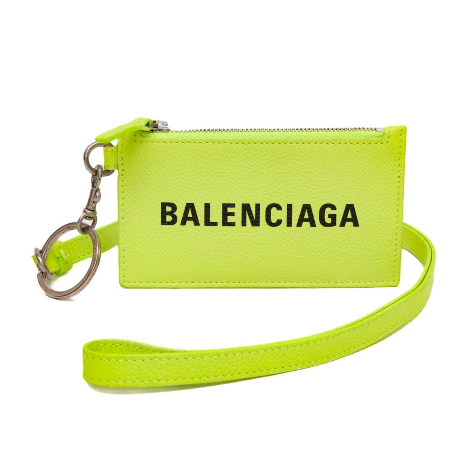 Leather coin case by Balenciaga: Leather coin case by Balenciaga A vibrant fluorescent yellow leather coin case by Balenciaga adds a pop of color to any wallet or bag, with its sleek design and spacious coin purse interior perfect