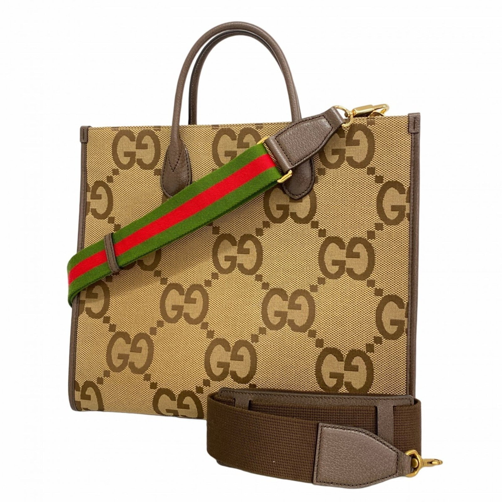 Gucci is a canvas tote bag: Gucci is a canvas tote bag A timeless Gucci canvas tote bag in rich beige and brown hues, adorned with elegant gold hardware, adds a touch of sophistication to any outfit. With its classic design and