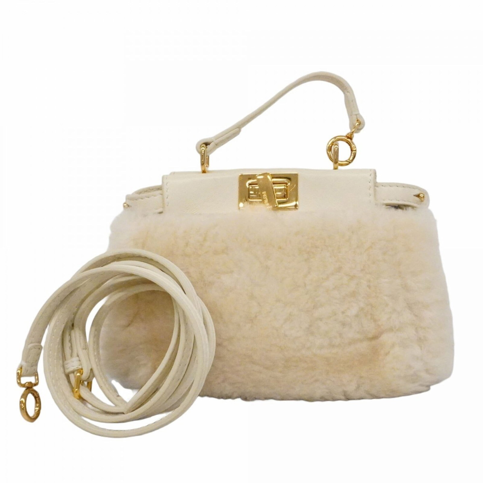Fendi handbag: Fendi handbag A timeless Fendi handbag in ivory, adorned with sleek gold hardware, adds an air of sophistication to any outfit. With its compact size and classic design, this luxurious bag is perfect