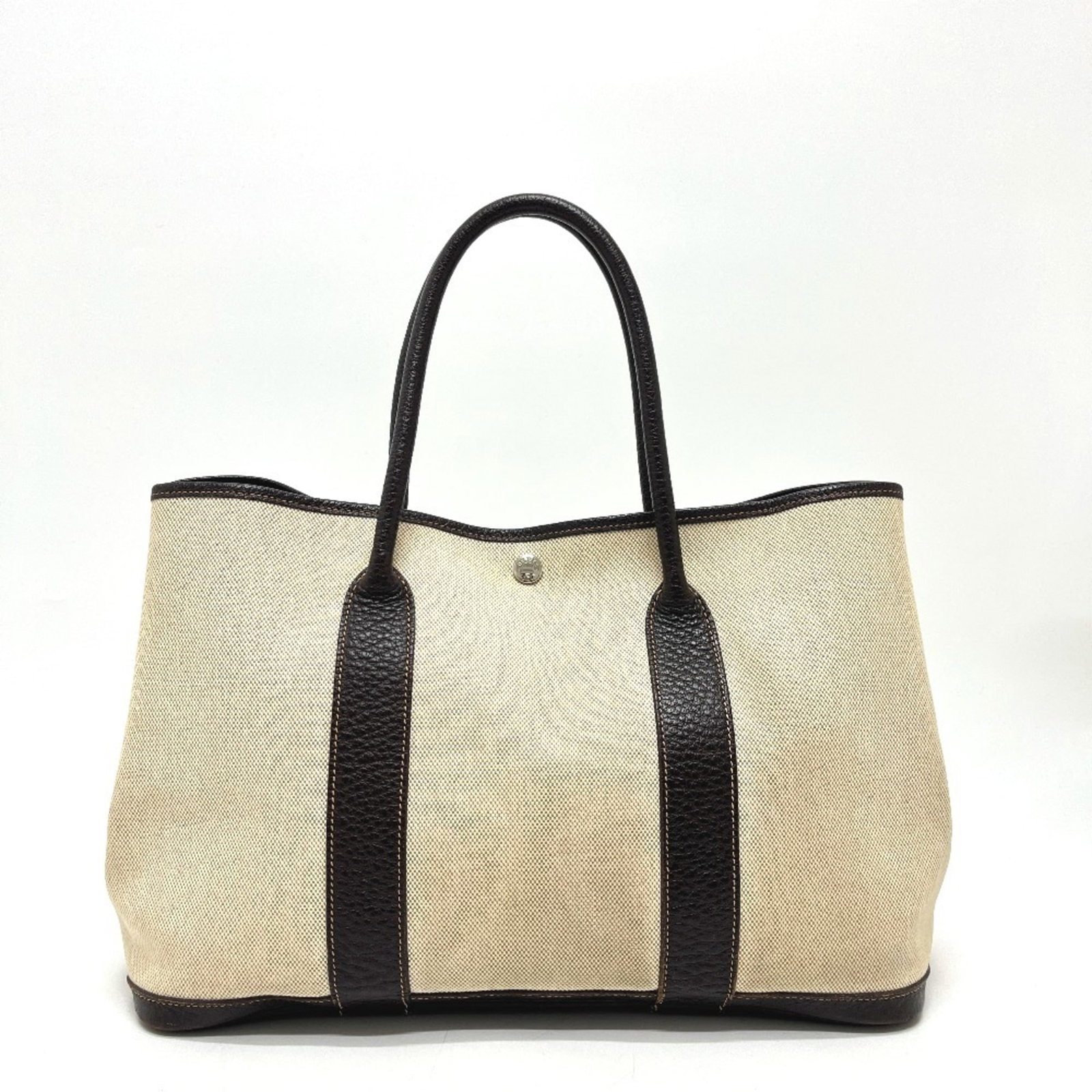 Hermes Handbag, Tote Bag Toile H, Leather: Hermes Handbag, Tote Bag Toile H, Leather A stunning pre-owned Hermes Toile H tote bag, boasting the iconic brand's signature style and exceptional craftsmanship. Made from high-quality leather and