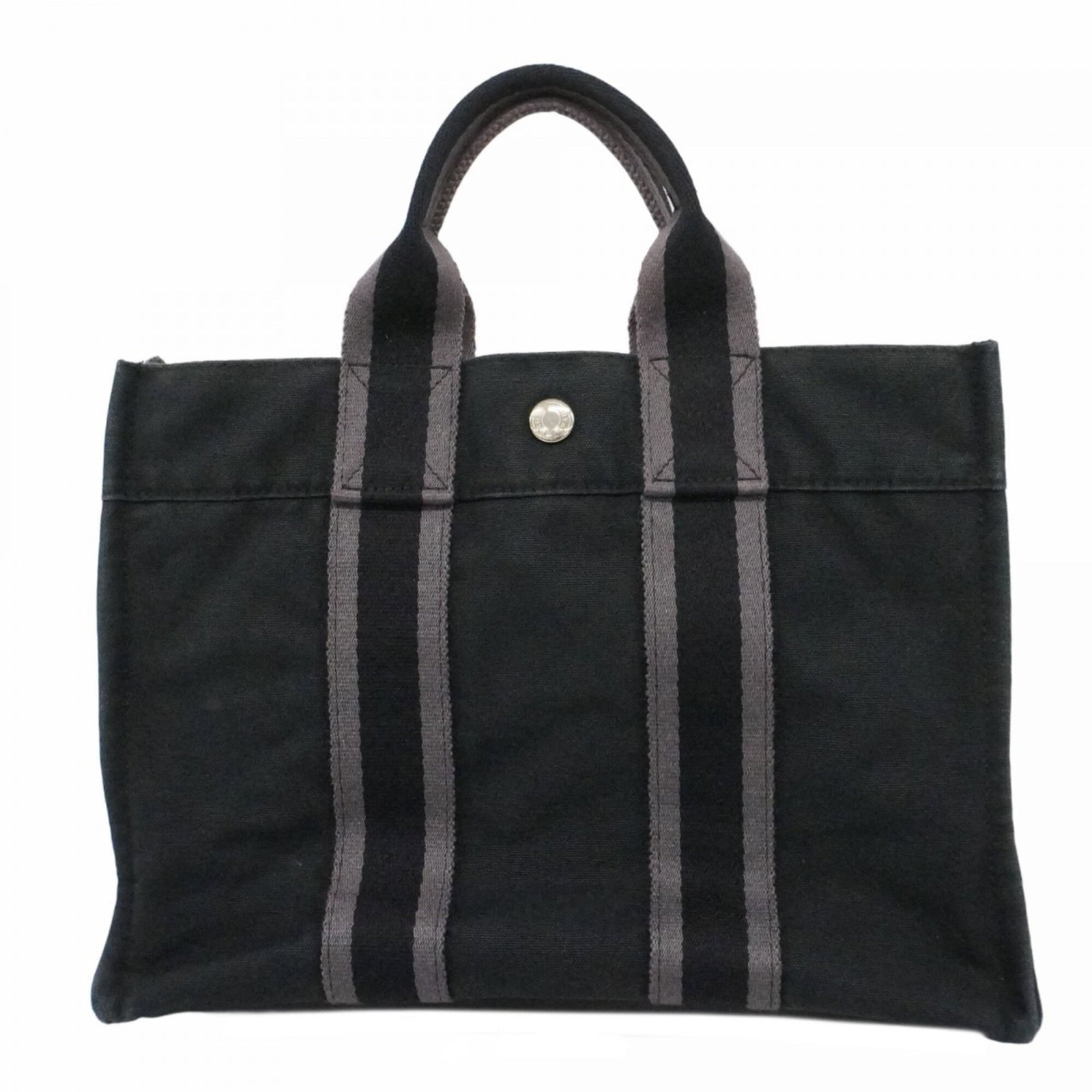 Hermes Tote Bag Canvas: Hermes Tote Bag Canvas A pre-owned Hermes tote bag in sleek black canvas, adorned with silver hardware, is now available. With its classic design and timeless appeal, this versatile canvas tote is