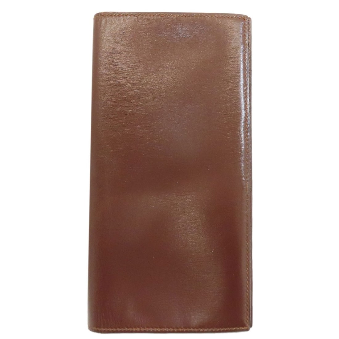 HERMES MC2 Fleming Long wallet (no coin pocket) Box calf: HERMES MC2 Fleming Long wallet (no coin pocket) Box calf The iconic HERMES MC2 Fleming Long wallet is a masterclass in understated elegance, boasting a stunning box calf construction and rich brown