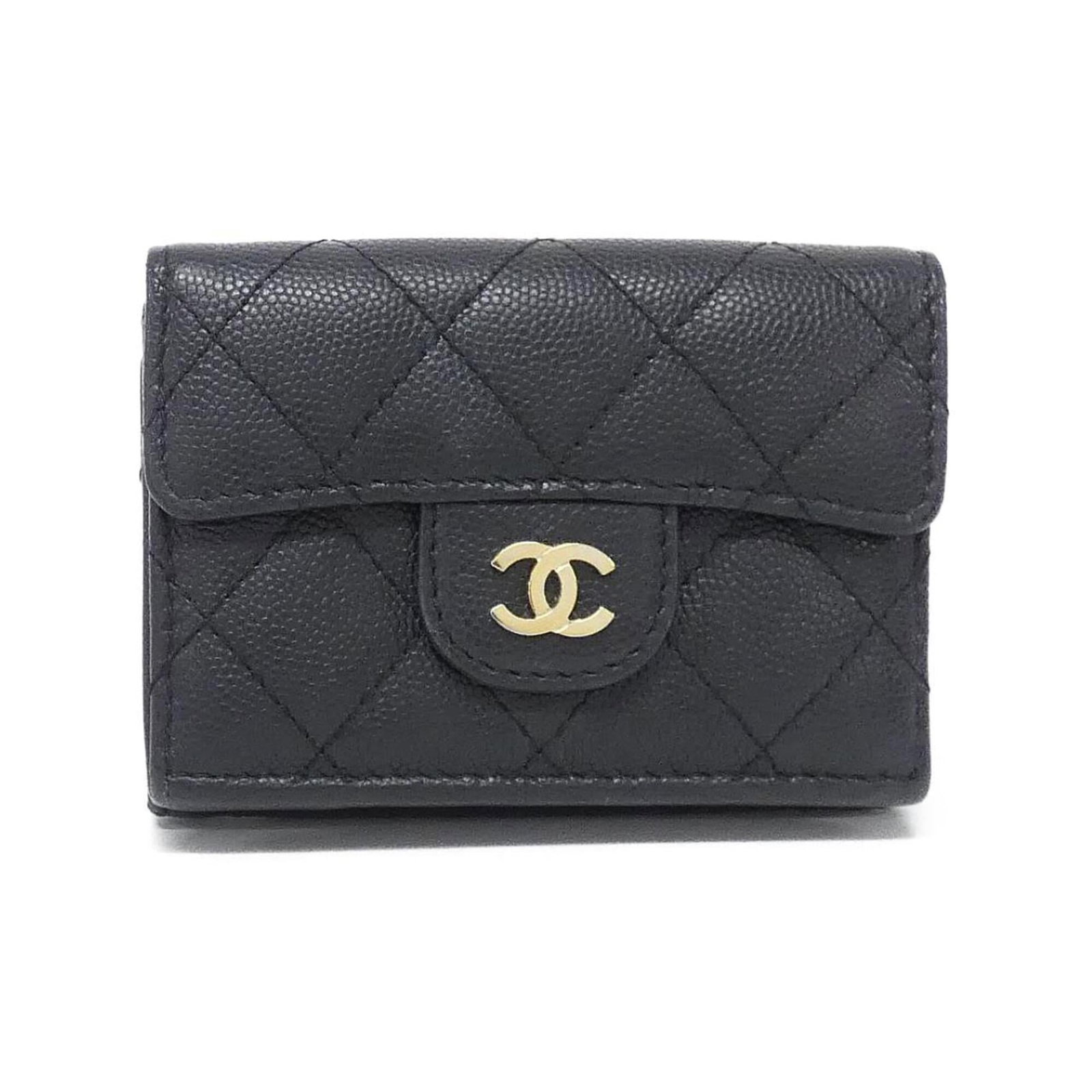 Calfskin bi-fold wallet by Chanel: Calfskin bi-fold wallet by Chanel A sleek and sophisticated bi-fold wallet from the iconic Chanel brand, crafted from rich grained calfskin in classic black. With its timeless design and premium