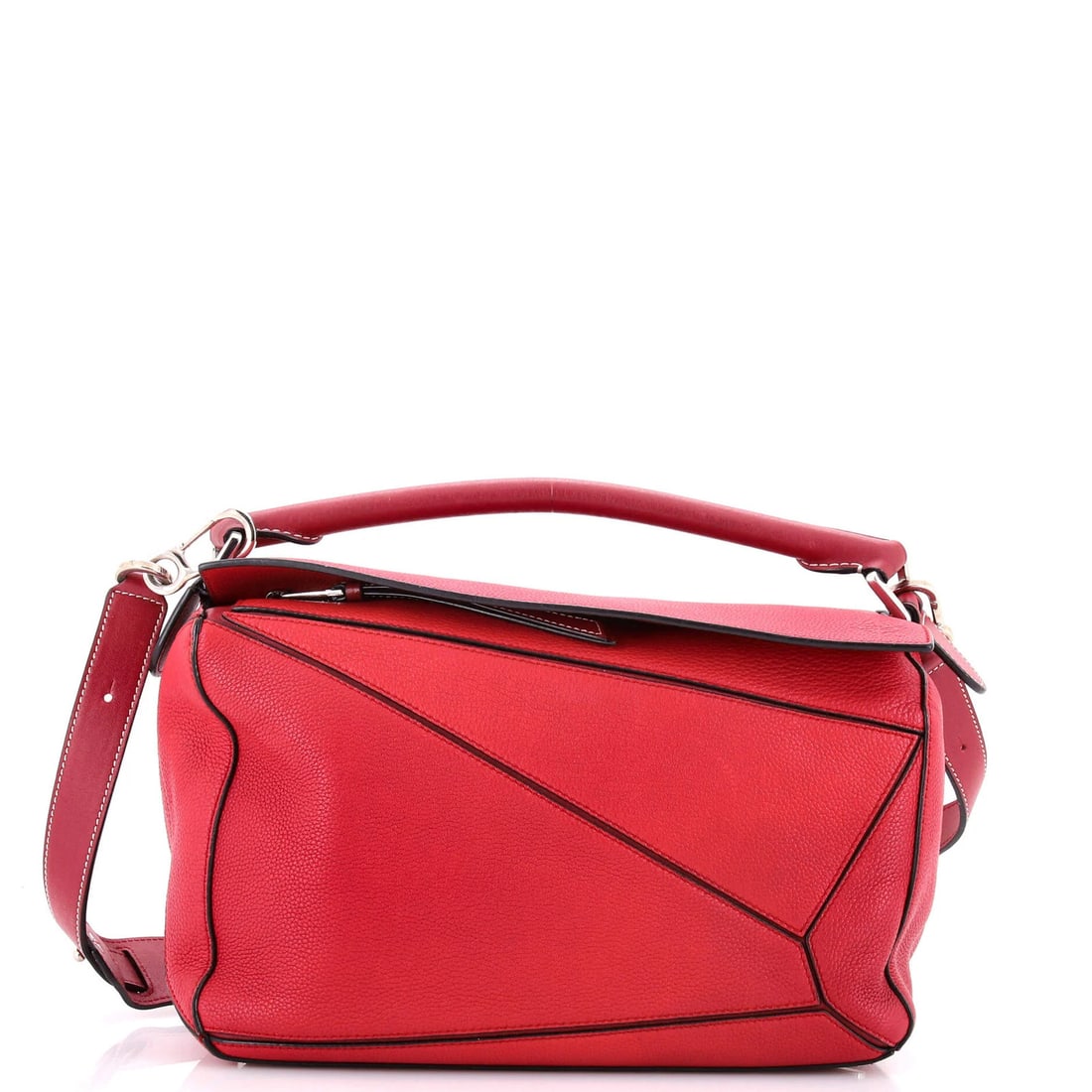 Loewe medium leather puzzle bag: Loewe medium leather puzzle bag A stunning Loewe Puzzle Bag in rich red leather, boasting a timeless design with clean lines and classic hardware. With its spacious interior and adjustable strap, this
