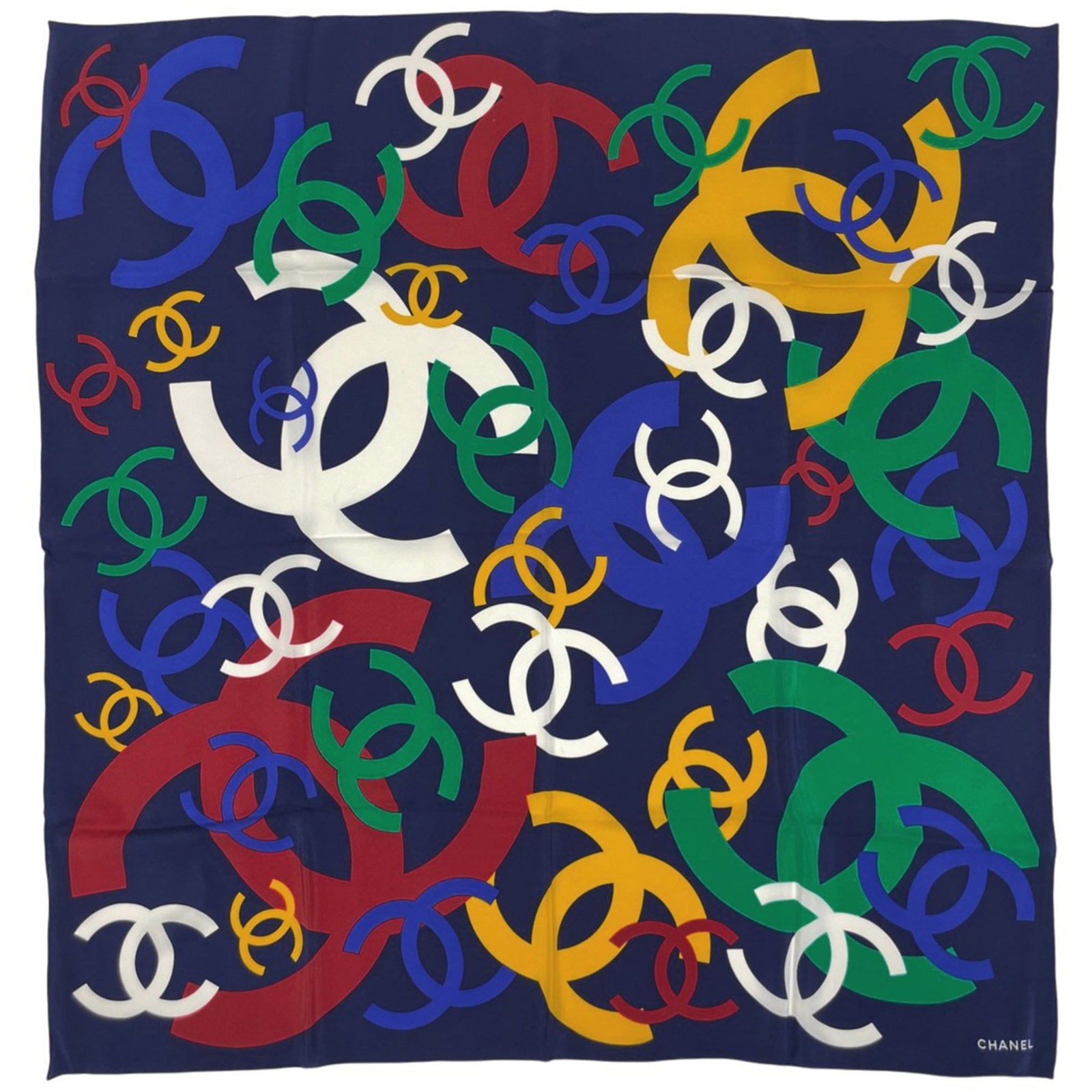 Silk scarf from Chanel: Silk scarf from Chanel A luxurious and versatile piece from the iconic Chanel brand, this silk scarf boasts a vibrant multi-color design and elegant navy accents, adding a touch of sophistication to