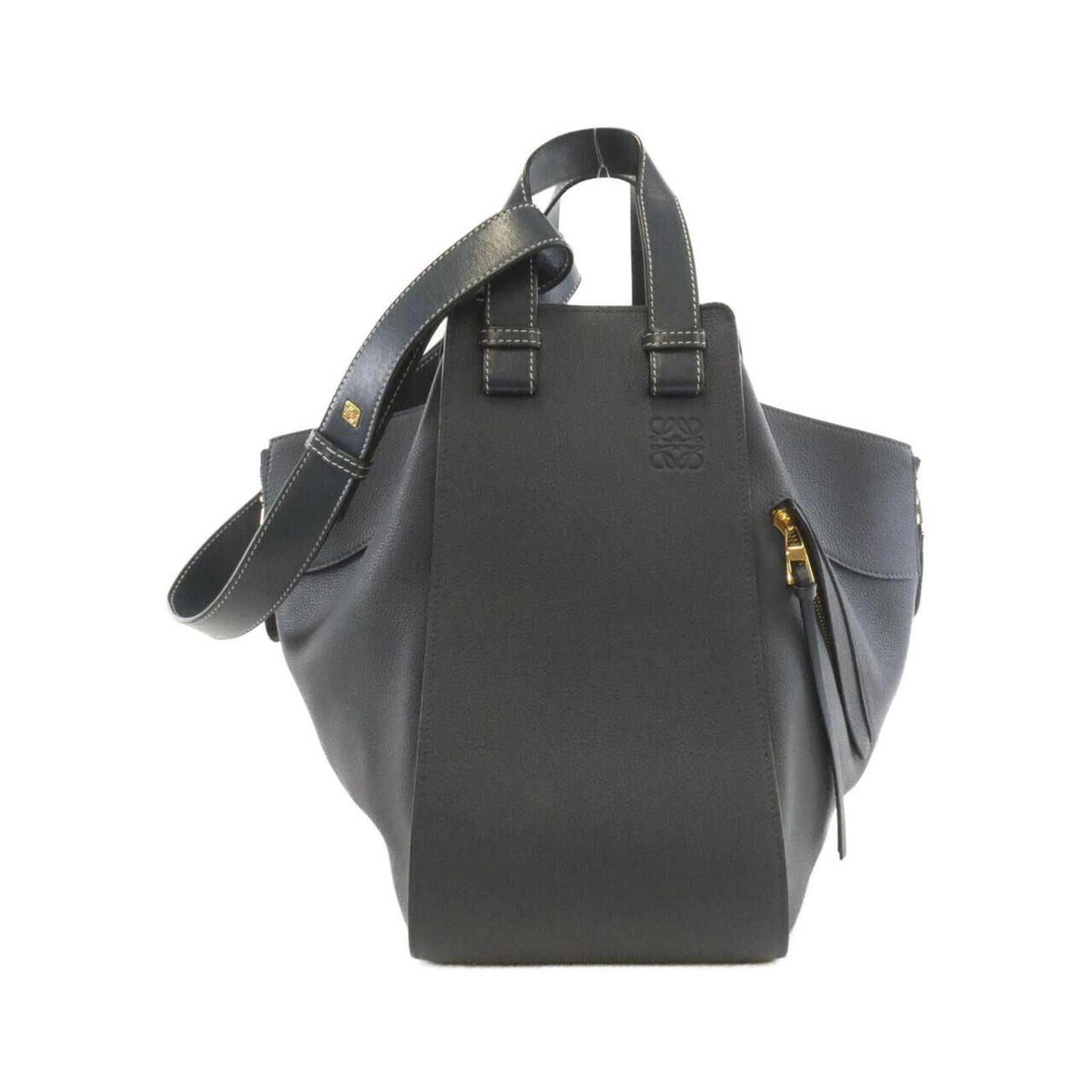 Leather Loewe Handbag: Leather Loewe Handbag A stunning blue Loewe handbag in excellent condition, despite its pre-loved status, boasts the iconic brand's signature craftsmanship and timeless design. Made from rich calfskin