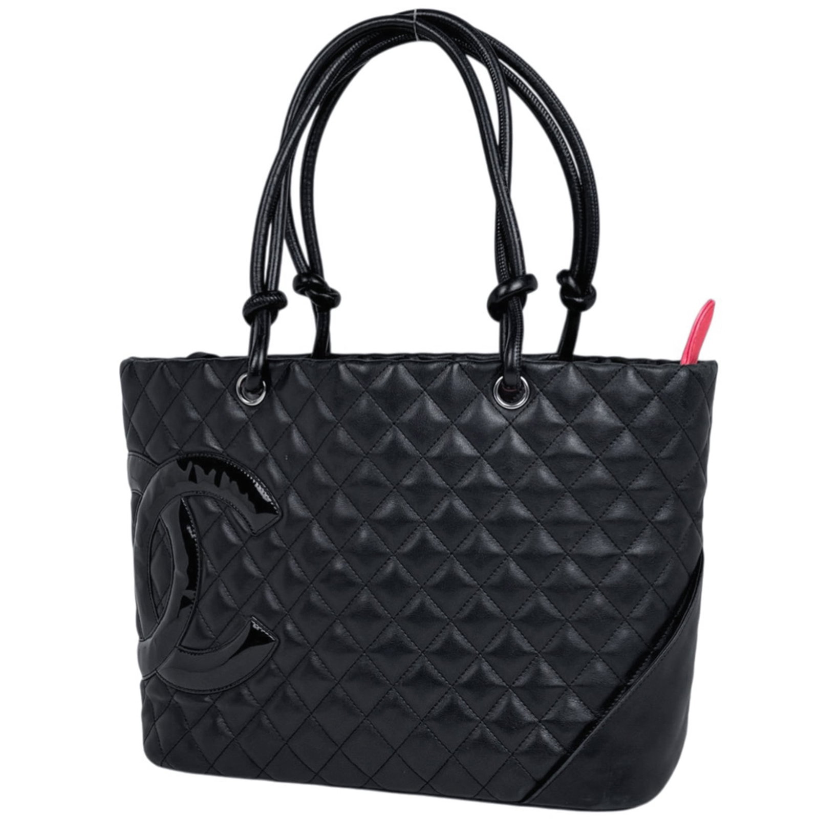 Chanel leather tote bag: Chanel leather tote bag A timeless black leather tote from the iconic Chanel brand, perfect for everyday use. With its classic shoulder strap and spacious interior, this bag is ideal for work or