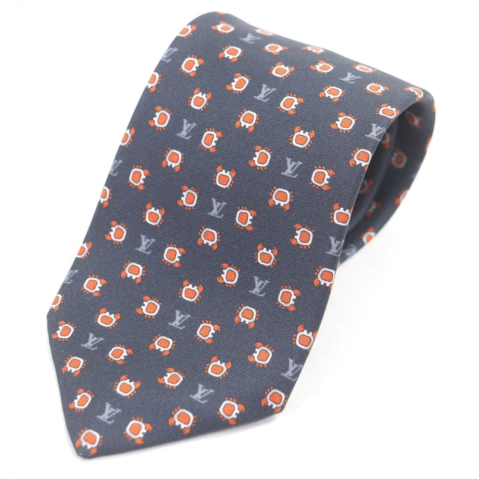 Louis Vuitton silk cravat: Louis Vuitton silk cravat A luxurious touch for any formal occasion, this 100% silk Louis Vuitton cravat boasts a classic navy hue and elegant design that exudes sophistication. Made from