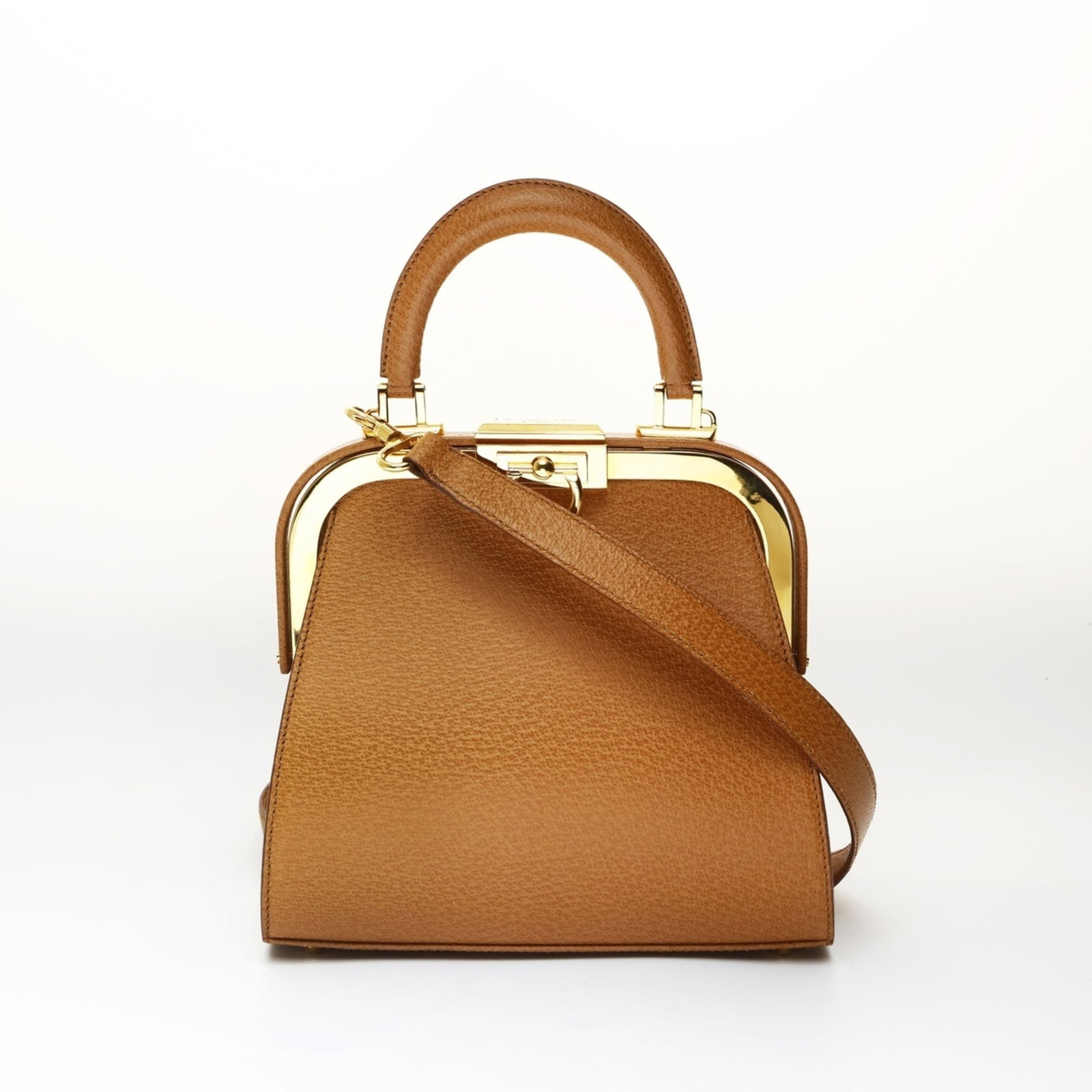 Christian Dior Handbag: Christian Dior Handbag A timeless piece of luxury, this Christian Dior handbag boasts a rich brown hue and elegant ball clasp closure, adding sophistication to any outfit. With its classic design and