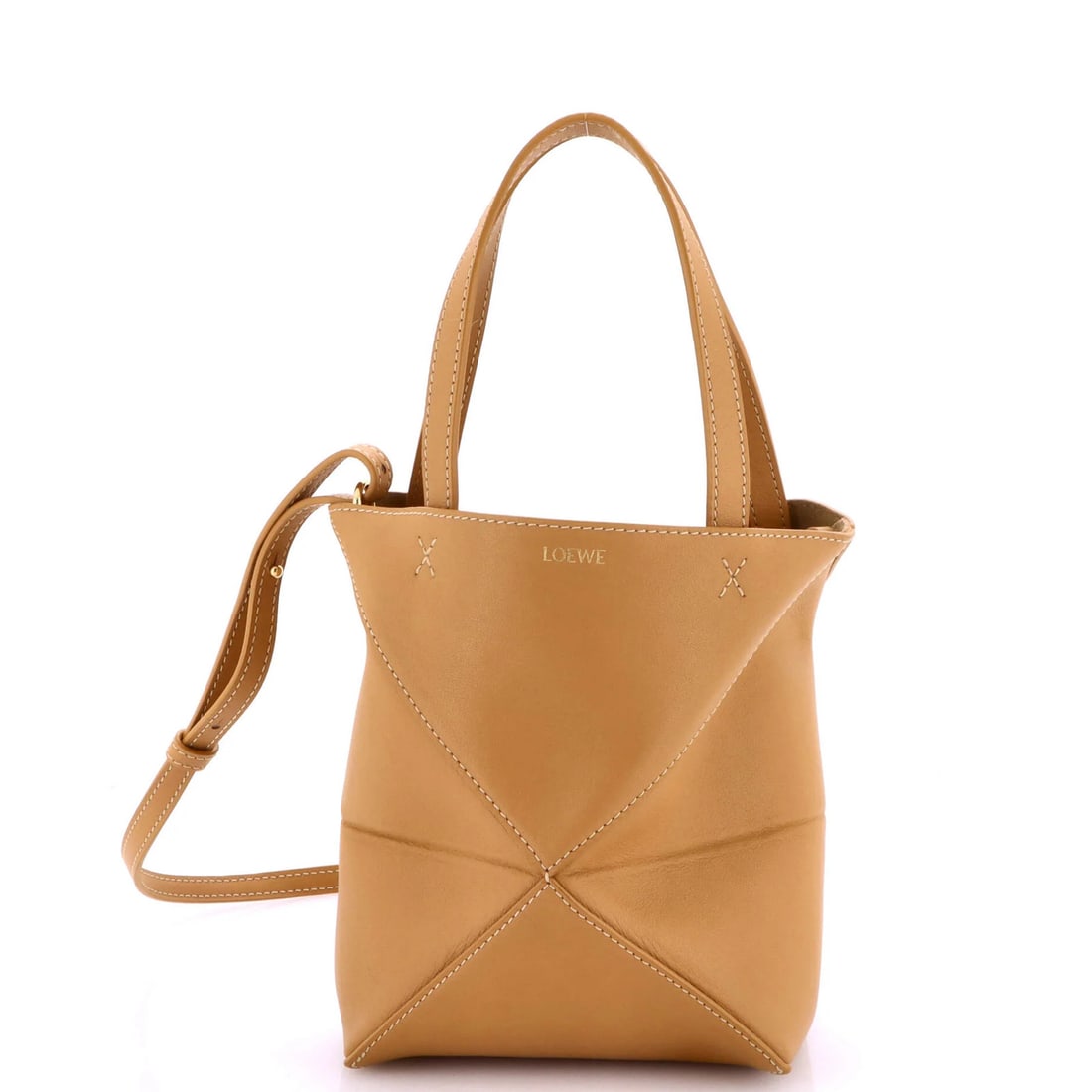 Leather fold mini tote from Loewe: Leather fold mini tote from Loewe A stylish and practical mini tote from renowned Spanish luxury brand Loewe, this Puzzle Fold Leather Mini Tote boasts a sleek brown leather exterior with gold