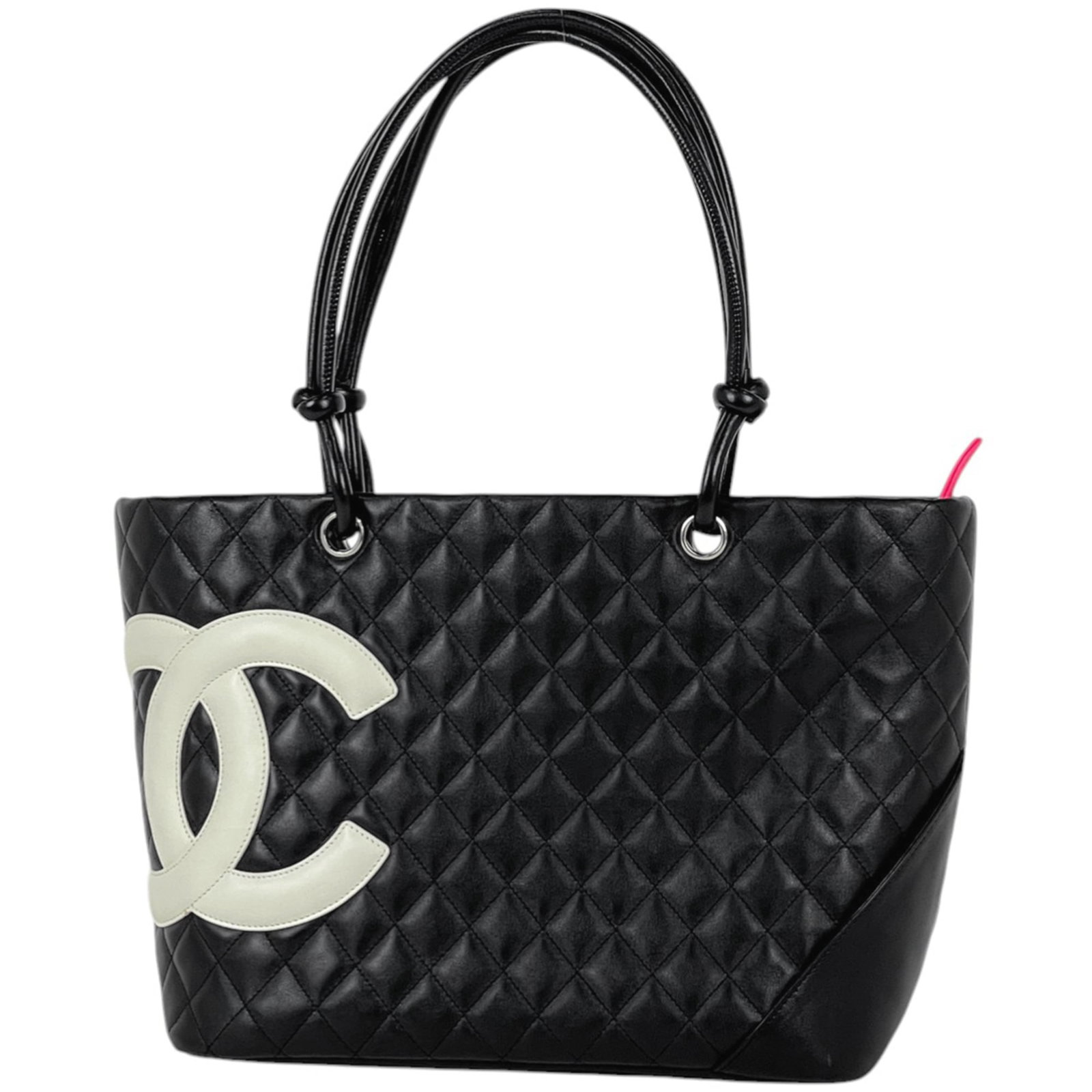 Chanel leather tote bag: Chanel leather tote bag A timeless black leather tote from the iconic Chanel brand, perfect for everyday use. With its classic shoulder strap and spacious interior, this bag is ideal for work or
