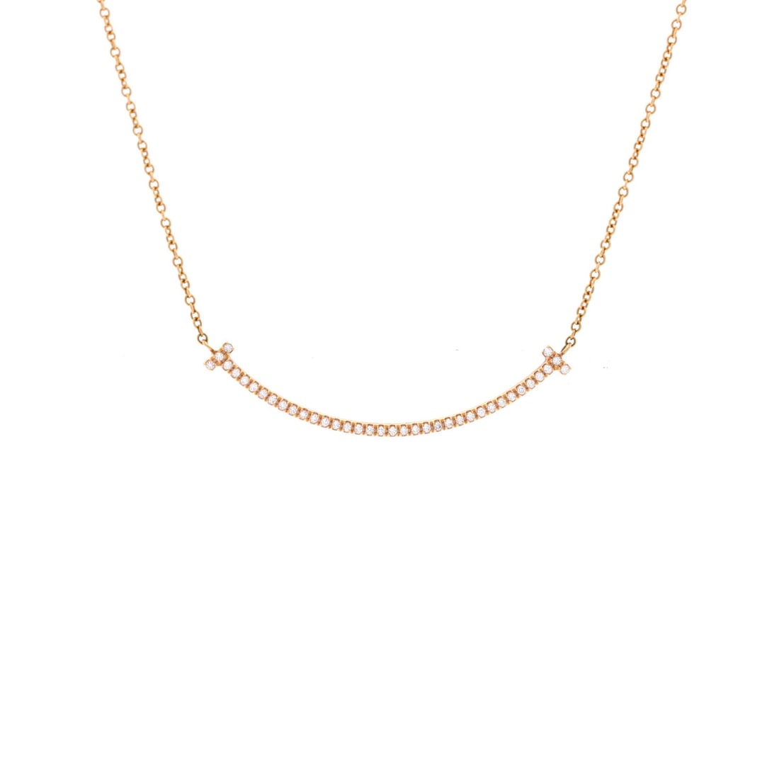 Tiffany & Co. T Smile Pendant Necklace 18K Rose Gold with Diamonds Small: Tiffany & Co. T Smile Pendant Necklace 18K Rose Gold with Diamonds Small Elevate your elegance with the iconic Tiffany & Co. T Smile Pendant Necklace, showcasing a delicate 18K rose gold pendant adorn