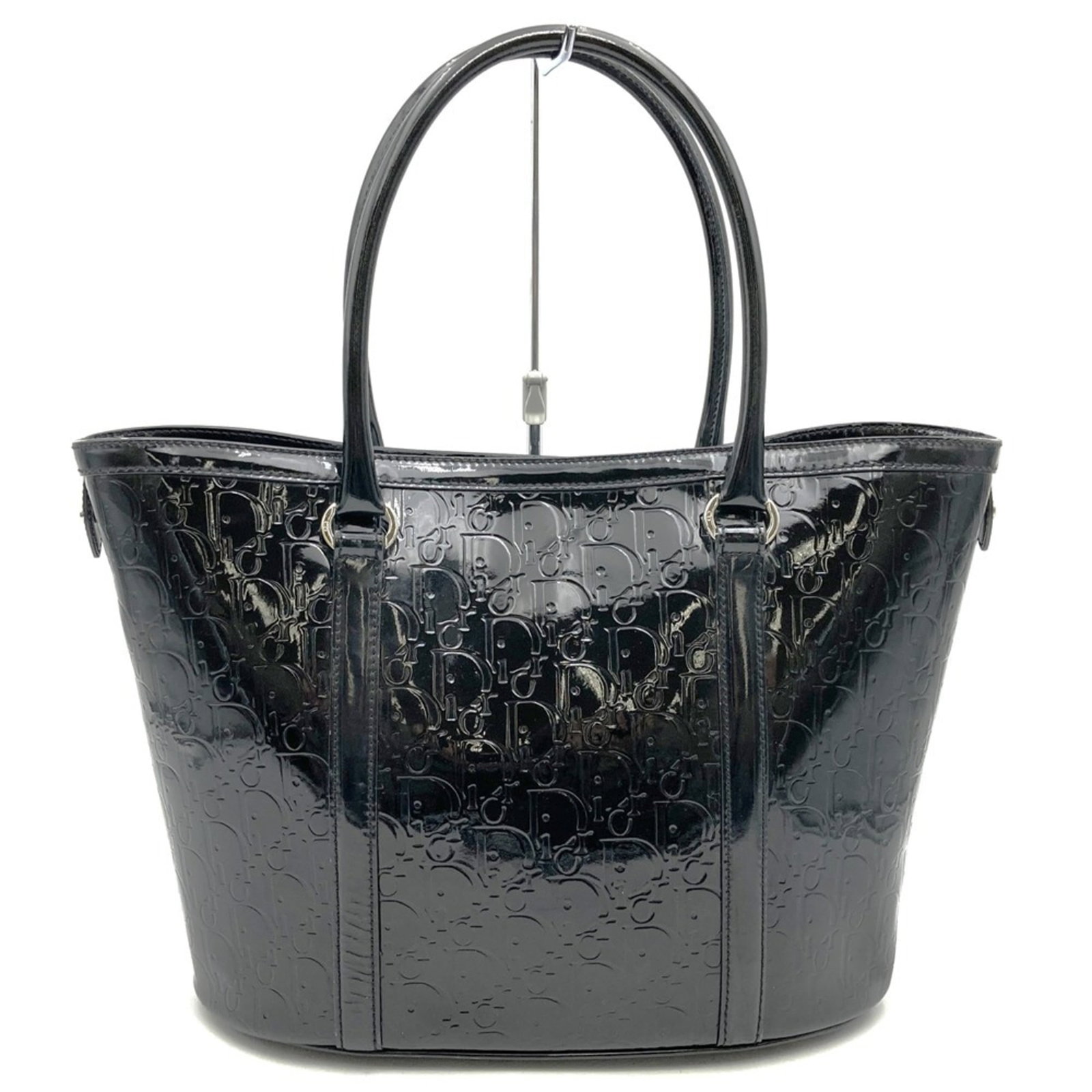 Christian Dior Patent Leather Tote Bag: Christian Dior Patent Leather Tote Bag Elevate your style with the iconic Christian Dior patent leather tote bag, boasting sleek black finish and timeless design. This pre-owned luxury handbag boasts