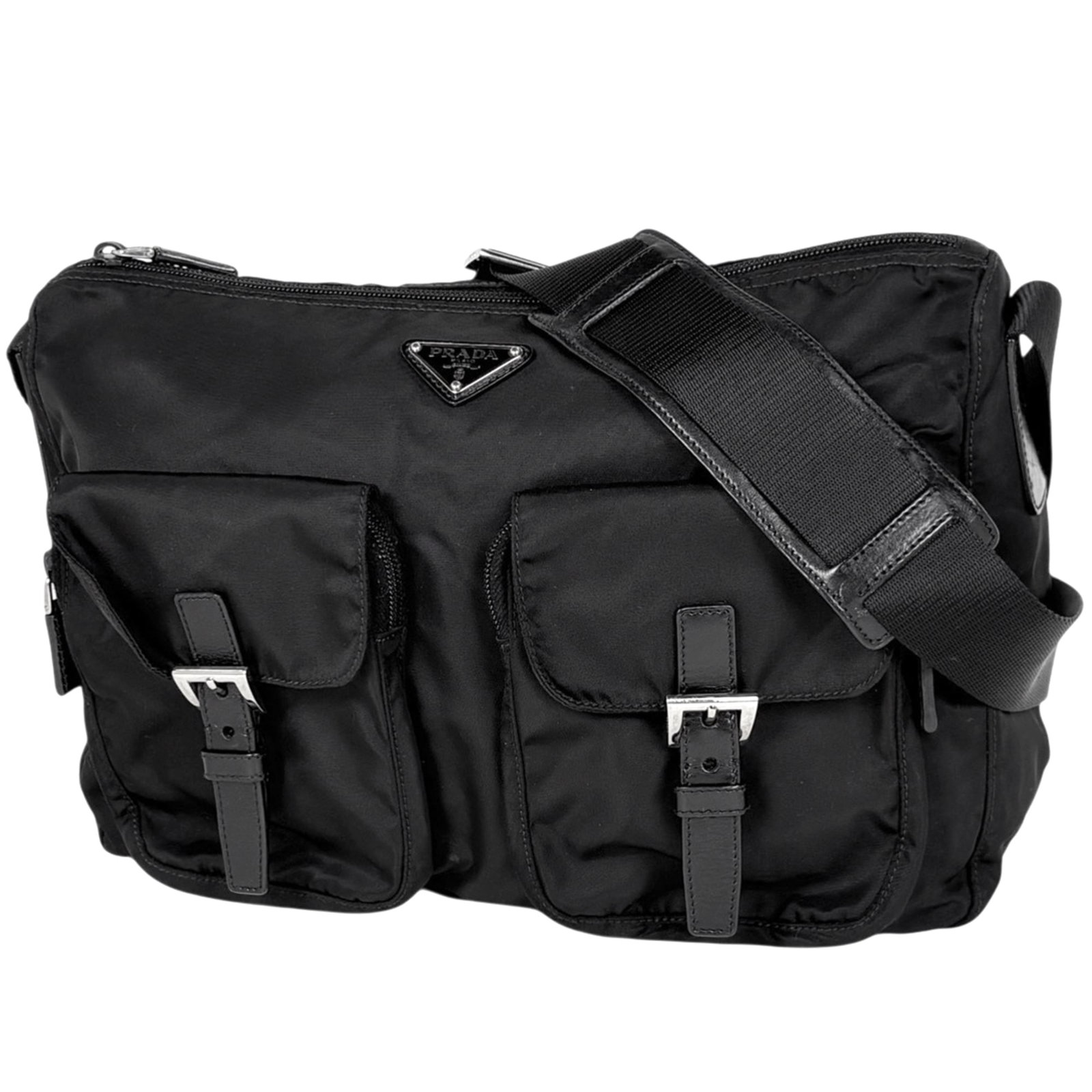 Nylon leather shoulder messenger bag by Prada: Nylon leather shoulder messenger bag by Prada A sleek and sophisticated shoulder messenger bag from Prada, crafted with durable nylon and luxurious leather in a timeless black hue. With its classic