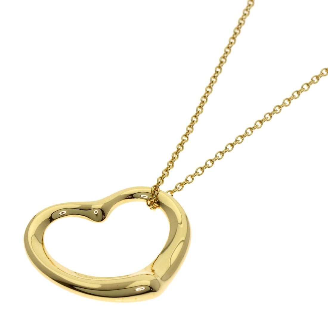 Tiffany and Co open heart necklace of gold yellow.: Tiffany and Co open heart necklace of gold yellow. A timeless Tiffany & Co. open heart necklace shines in 18k yellow gold, exuding elegance and sophistication. This exquisite piece is crafted from hig