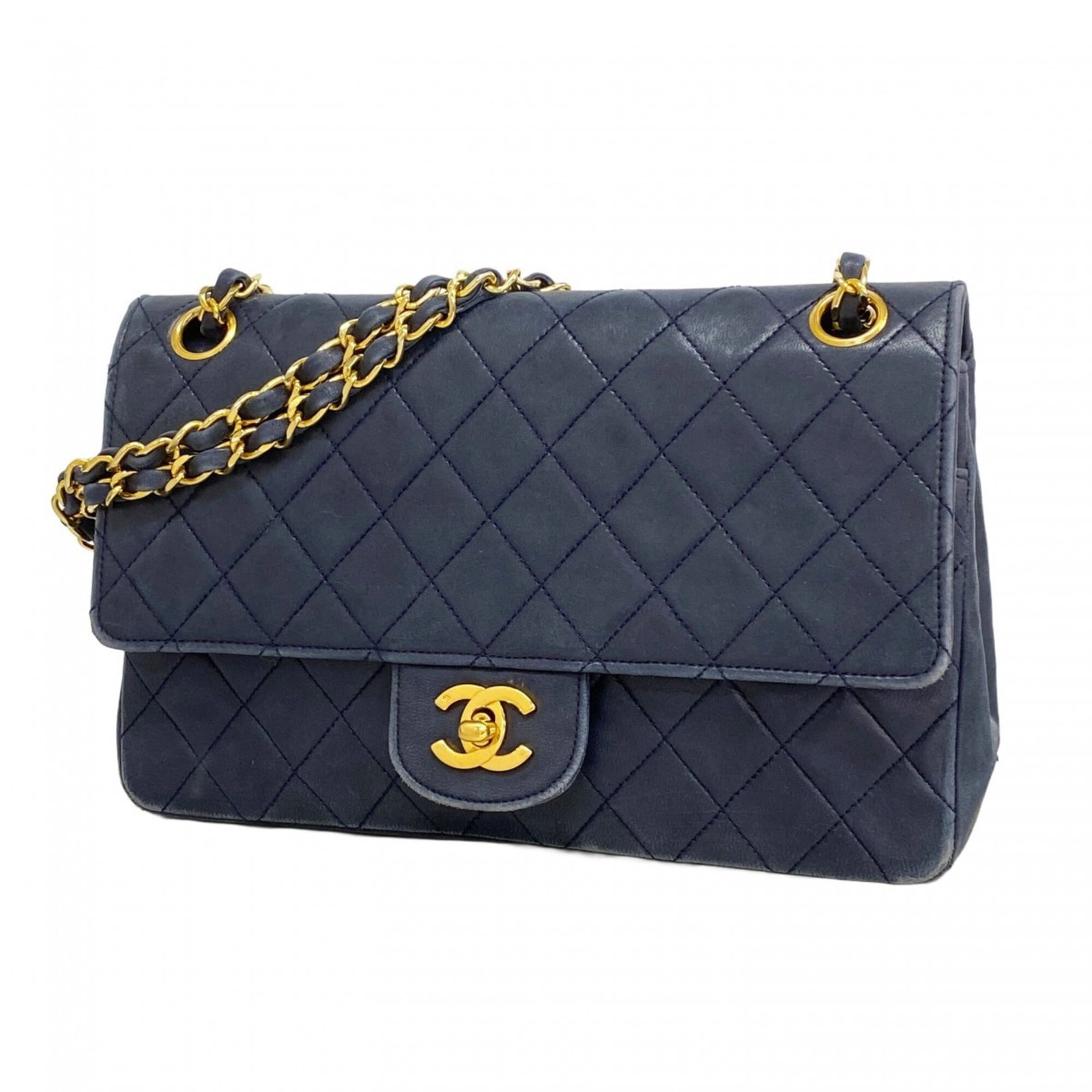 Chanel Leather Shoulder Bag: Chanel Leather Shoulder Bag A timeless and sophisticated Chanel leather shoulder bag, crafted from luxurious lambskin in a classic navy hue, adorned with gold hardware for an air of elegance. With its