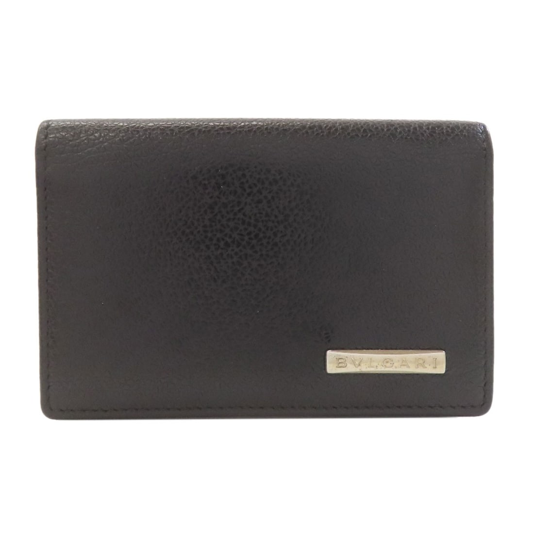BVLGARI leather card case: BVLGARI leather card case Elevate your everyday essentials with the sleek and sophisticated BVLGARI leather card case, crafted from rich Italian leather in a timeless black hue. This understated yet