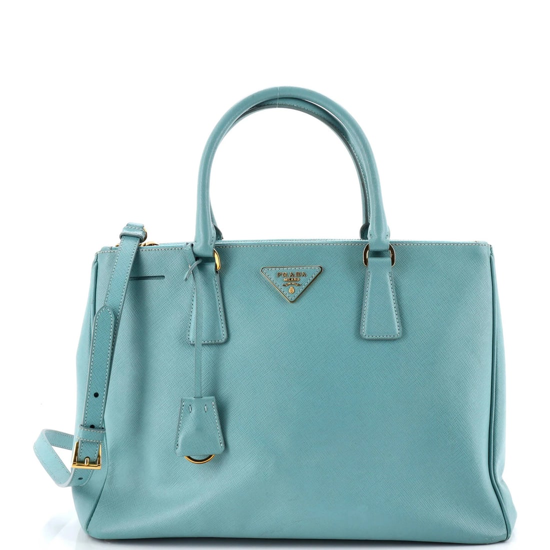 Lux medium Saffiano leather double tote from Prada: Lux medium Saffiano leather double tote from Prada A stunning Prada Lux medium Saffiano leather double tote in rich blue, boasting sleek lines and premium quality that exudes sophistication. With its