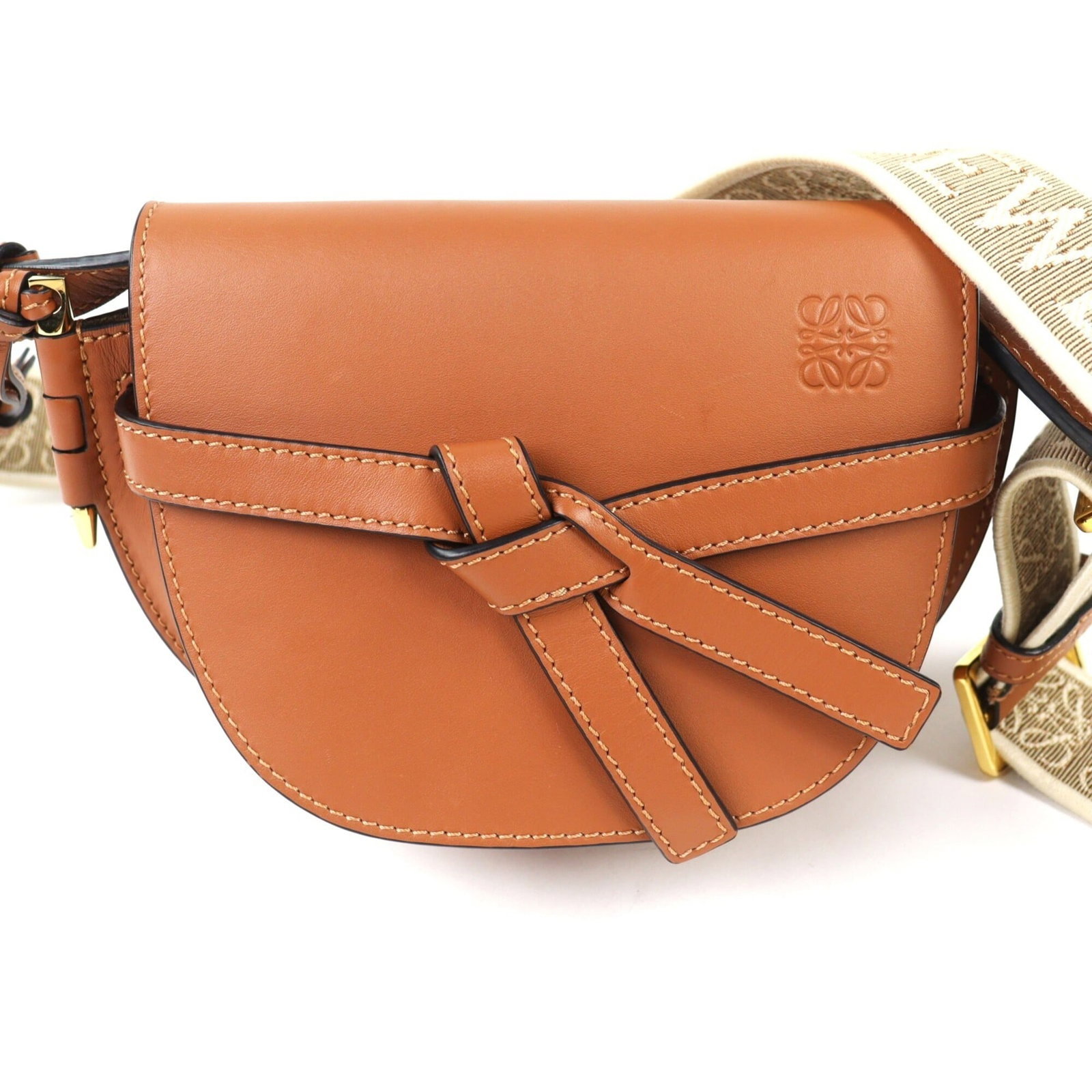 Leather shoulder bag by Loewe: Leather shoulder bag by Loewe A timeless Loewe classic, this beautifully crafted leather shoulder bag boasts rich brown calfskin and premium leather construction, exuding effortless elegance. With