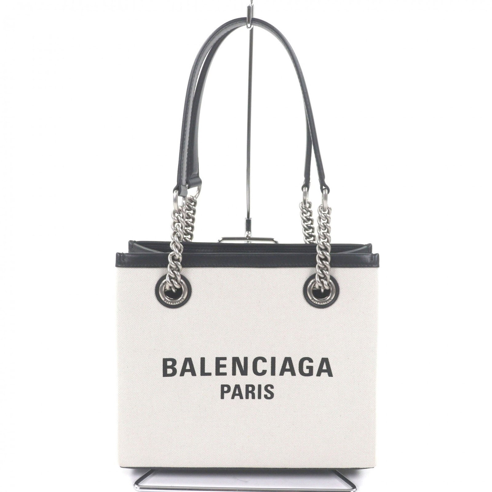 Canvas leather tote bag by Balenciaga: Canvas leather tote bag by Balenciaga Elevate your everyday style with the iconic Balenciaga canvas leather tote bag, boasting a sleek black and light beige color combination that exudes