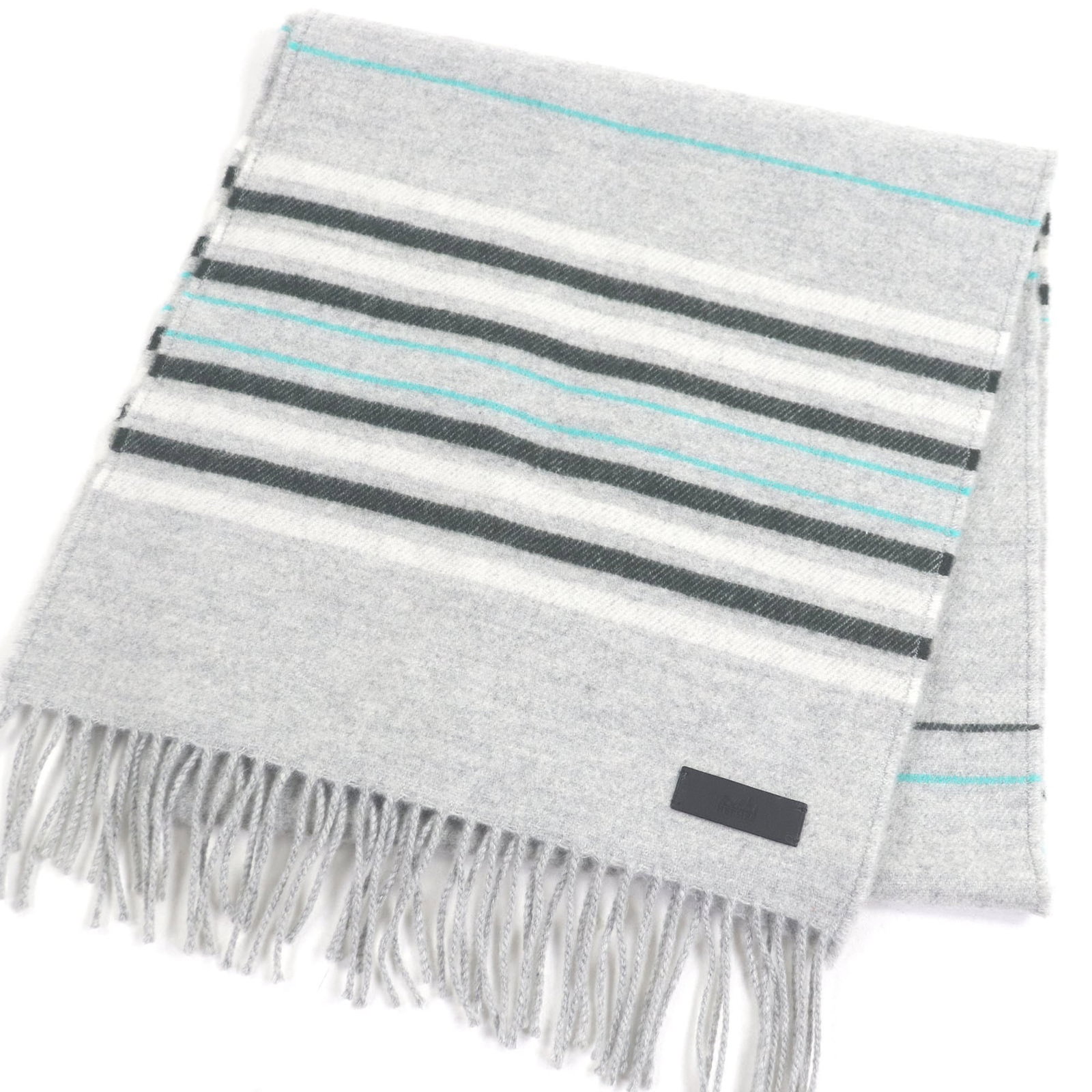 Hermes stole cashmere: Hermes stole cashmere Experience the epitome of luxury with this exquisite Hermes stole, crafted from 100% cashmere in a soft, light gray hue that exudes sophistication and elegance. Made from the fin
