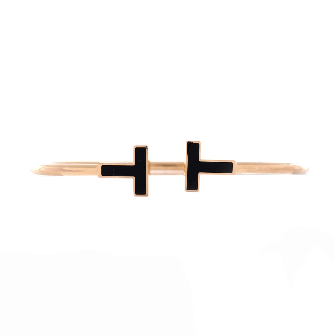 Tiffany & Co T Wire with 18K Rose Gold and Onyx: Tiffany & Co T Wire with 18K Rose Gold and Onyx Elevate your style with the iconic Tiffany & Co T Wire bracelet, set in 18K rose gold and adorned with a striking onyx stone. This timeless piece boasts