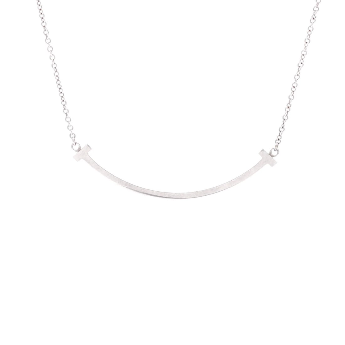 Tiffany & Co. Gold Necklace with Small T Smile Pendant: Tiffany & Co. Gold Necklace with Small T Smile Pendant Elegant and sophisticated, the Tiffany & Co. T Smile Pendant Necklace is a timeless piece of 18K white gold jewelry that exudes refinement. With