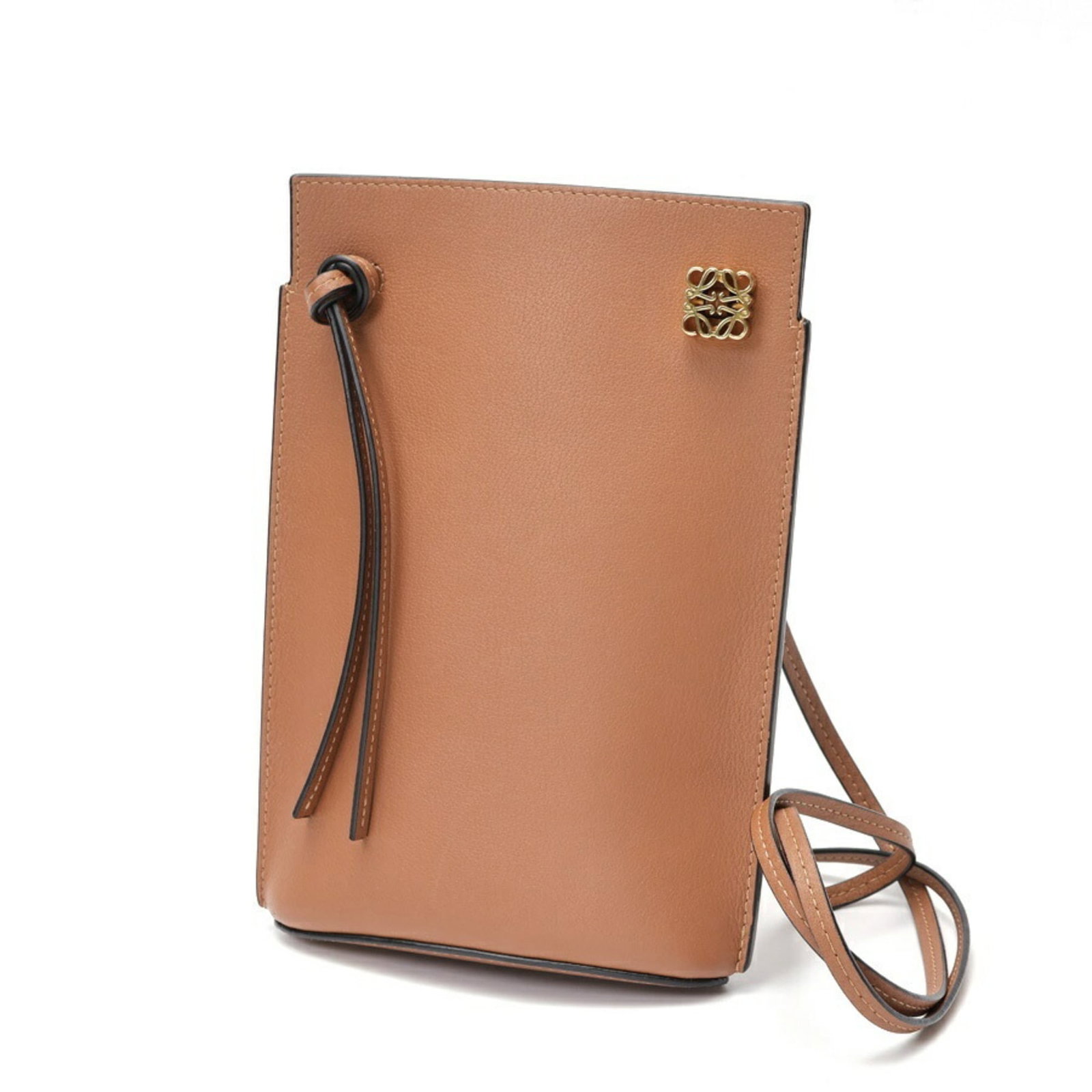 Leather Loewe Pouch: Leather Loewe Pouch A timeless piece from the iconic Spanish brand, this brown leather Loewe pouch boasts classic design and premium quality. With its rich, supple leather and understated elegance,