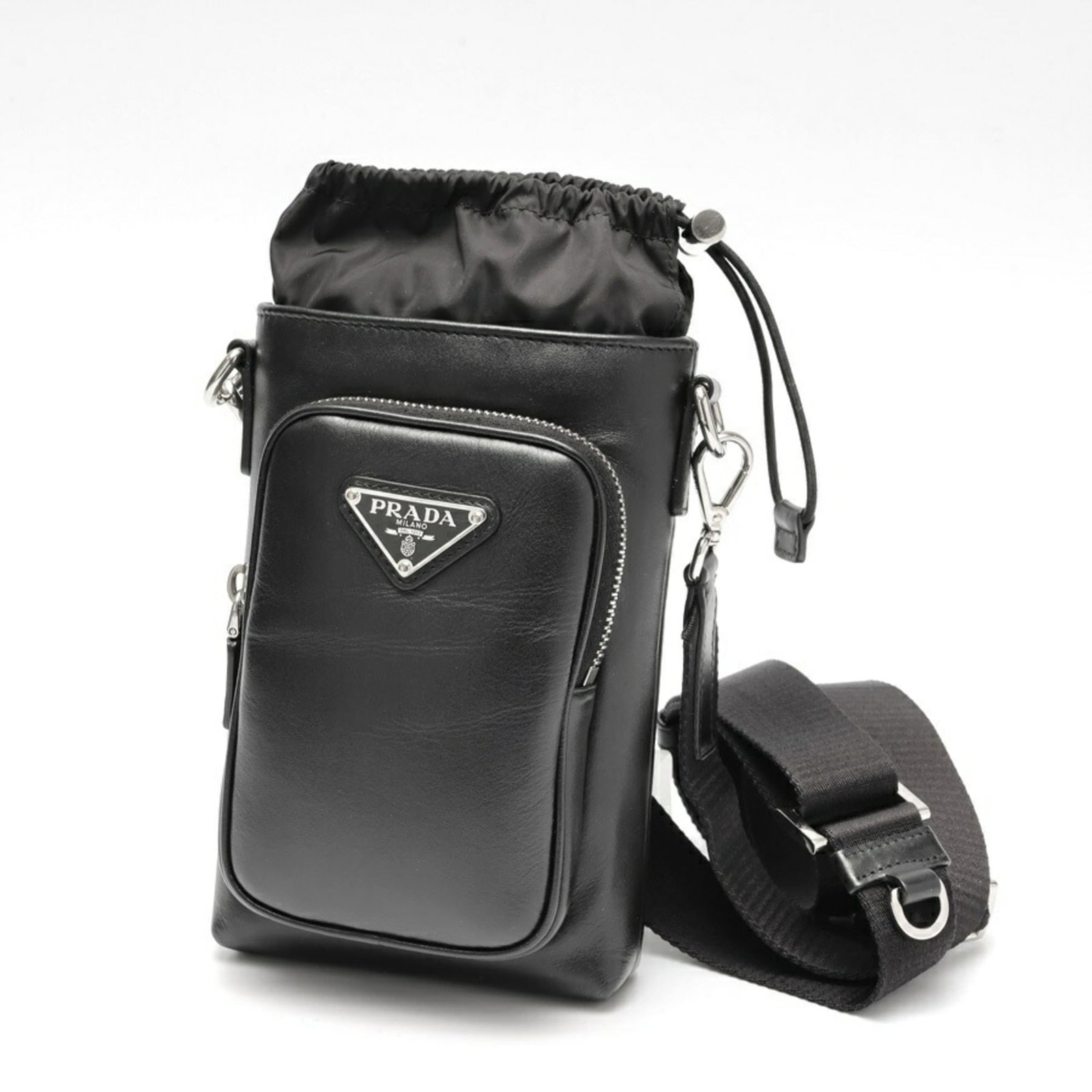 Leather Prada Pouch: Leather Prada Pouch A sleek and sophisticated leather pouch from Prada, perfect for adding an air of luxury to your daily essentials. This black leather pouch boasts a classic design with clean lines