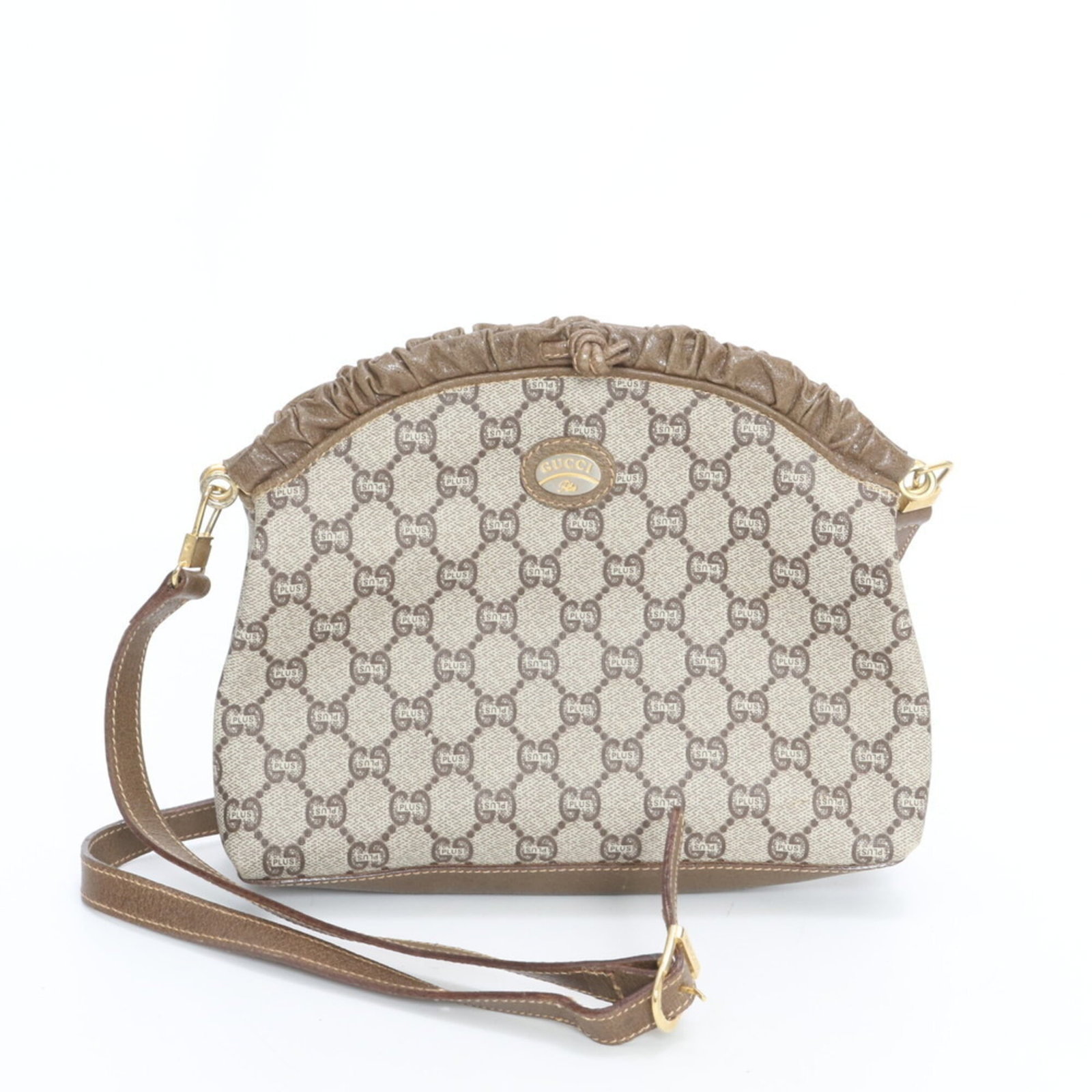 Gucci leather coated canvas shoulder bag: Gucci leather coated canvas shoulder bag Elevate your everyday with the timeless Gucci leather coated canvas shoulder bag, boasting a chic beige hue and premium leather accents that add a touch of