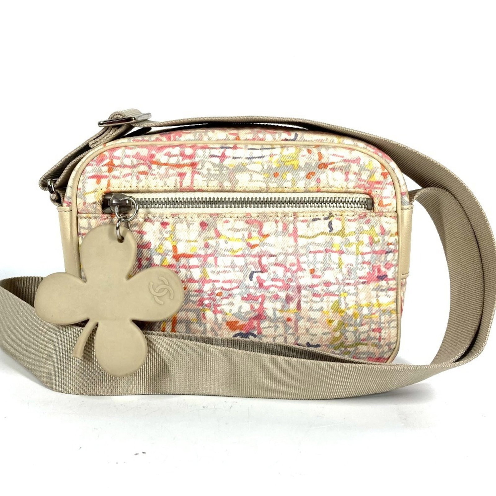 Canvas leather shoulder bag by Chanel: Canvas leather shoulder bag by Chanel A stylish and timeless piece, this Chanel canvas leather shoulder bag boasts the iconic brand's signature elegance with its pink hue and sleek design. With its