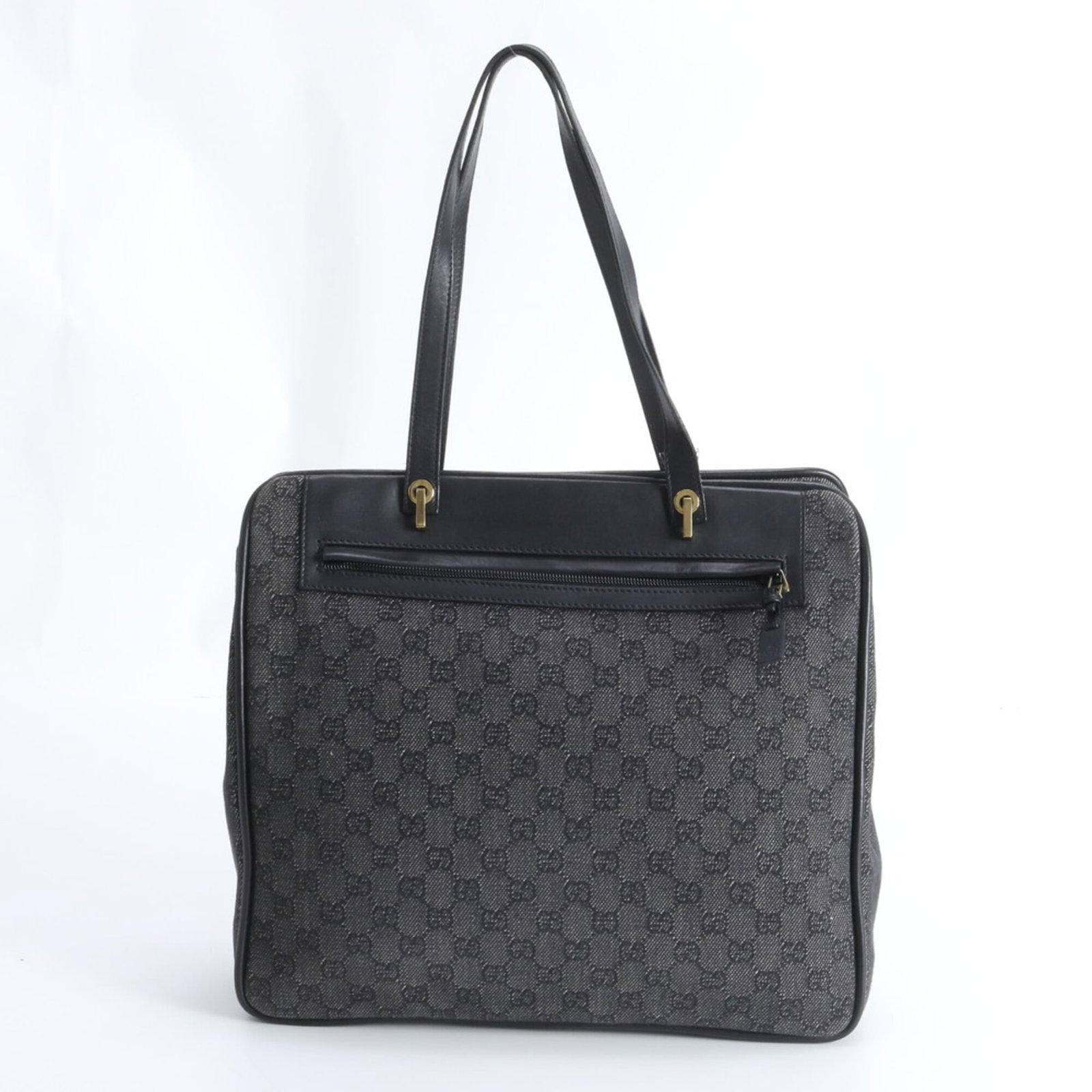 Gucci Leather Canvas Tote Bag: Gucci Leather Canvas Tote Bag Elevate your everyday style with this pre-loved Gucci Leather Canvas Tote Bag, boasting sleek black and gray hues that exude sophistication. With its sturdy leather and