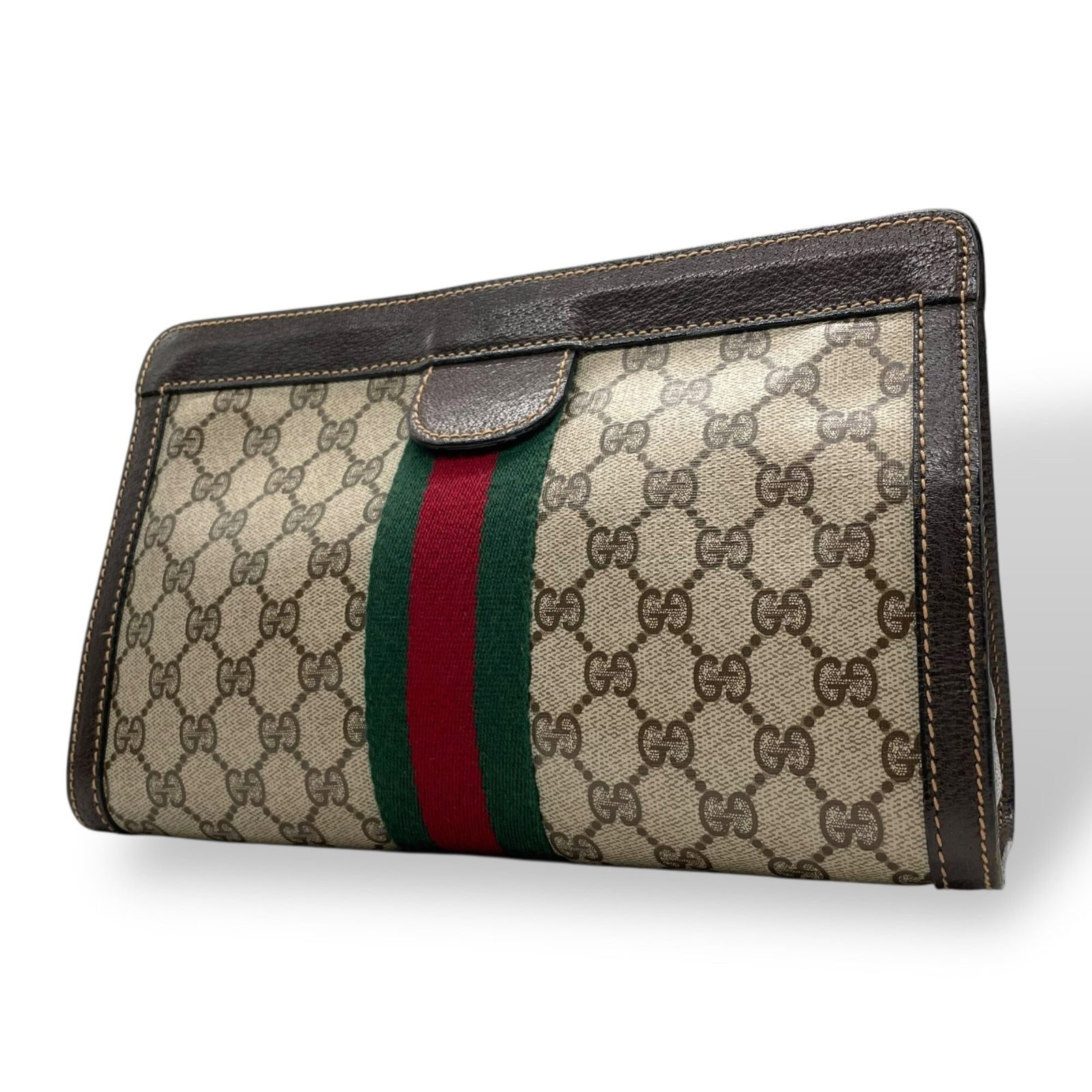 Gucci Clutch Bag, Pouch Gg Supreme, Leather: Gucci Clutch Bag, Pouch Gg Supreme, Leather Elevate your style with this luxurious Gucci clutch bag, crafted from rich Gg Supreme leather and boasting a classic brown hue. With its sleek 18cm x 27cm